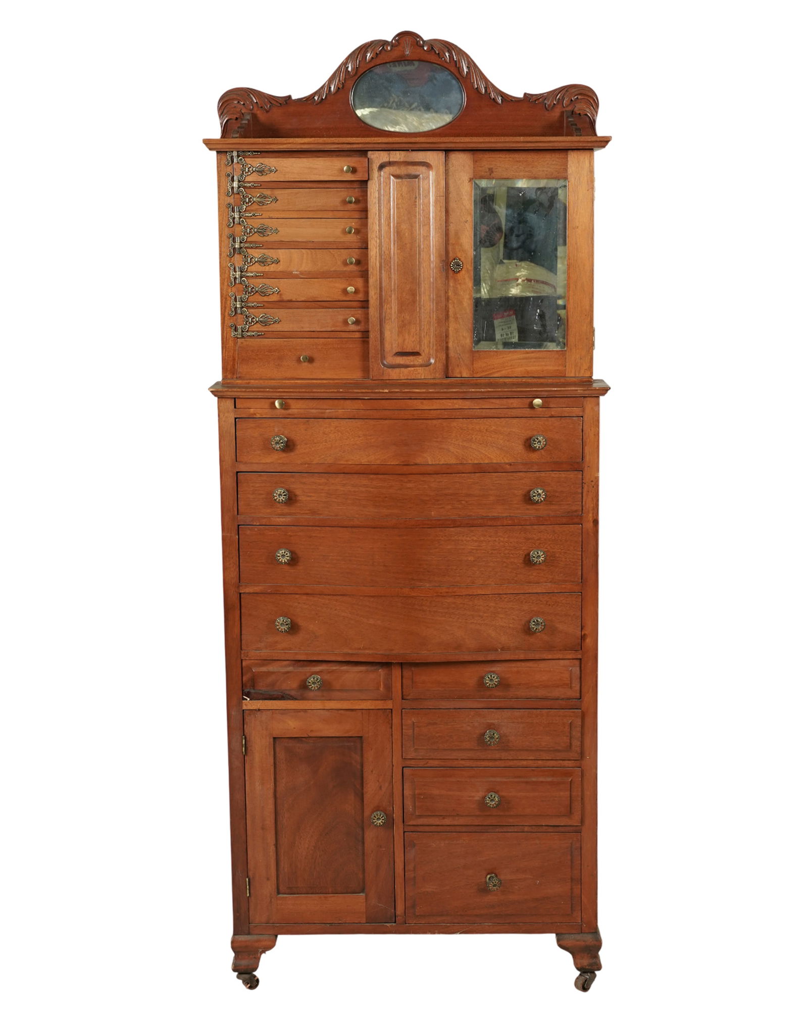 A Ransom and Randolph Co. Victorian Oak Dental Cabinet: with label to interior 65 1/2 x 26 1/4 x 15 1/2 in. (166.4 x 66.7 x 39.4 cm.)
