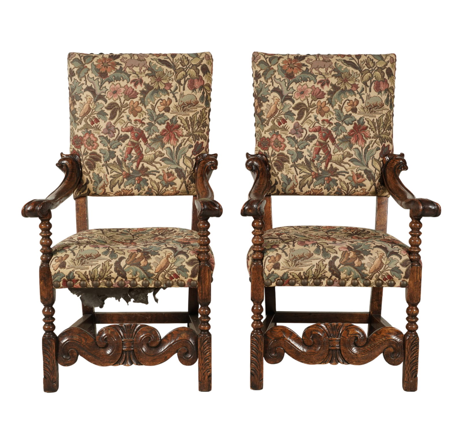 A Pair of Baroque-Style Carved Oak Armchairs: covered with tapestry-style fabric 46 x 25 1/2 x 23 in. (116.8 x 64.8 x 58.4 cm.) Seat height: 18 in. (45.7 cm.)