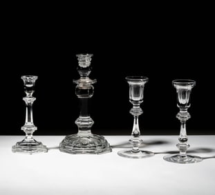 A Group of Waterford and Baccarat Crystal Candlesticks
