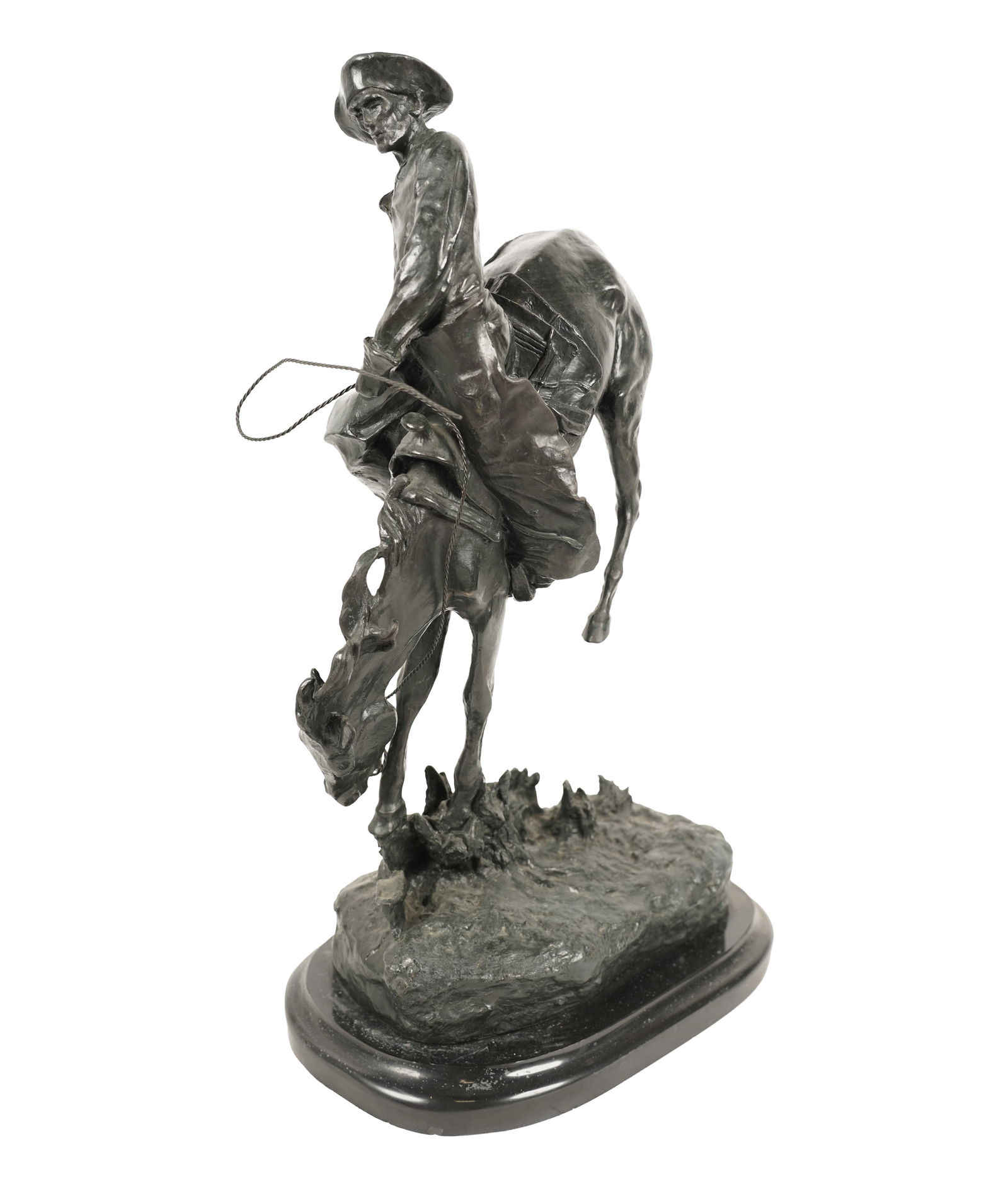 After Frederic Remington, Outlaw: patinated bronze, on marble base; inscribed in casting "Copyright Frederic Remington" Overall: 23 1/4 x 14 x 9 in. (59.1 x 35.6 x 22.9 cm.)