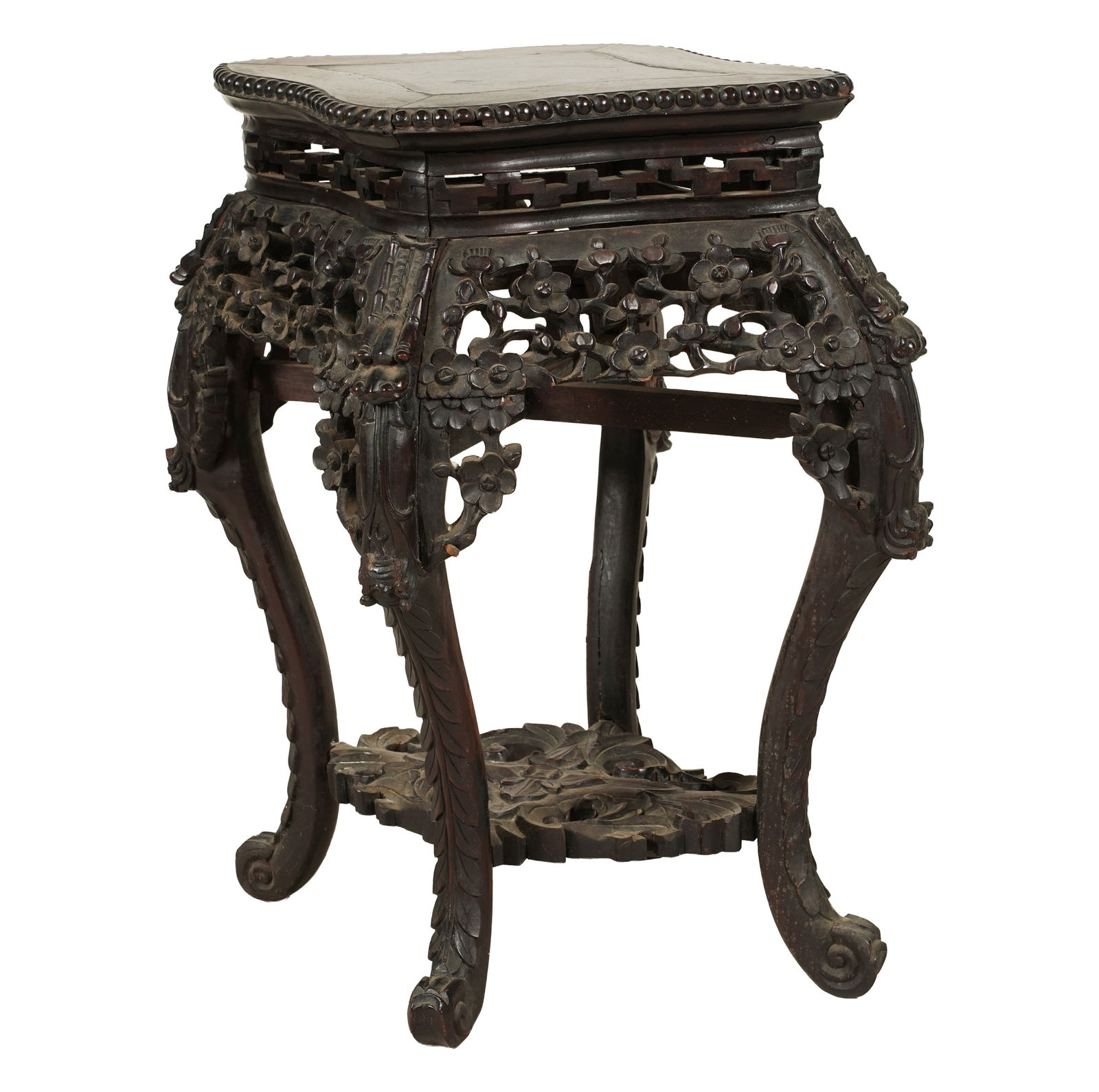 A Chinese Carved Wood Fern Stand: lozenge-shaped 23 x 20 x 16 in. (58.4 x 50.8 x 40.6 cm.)