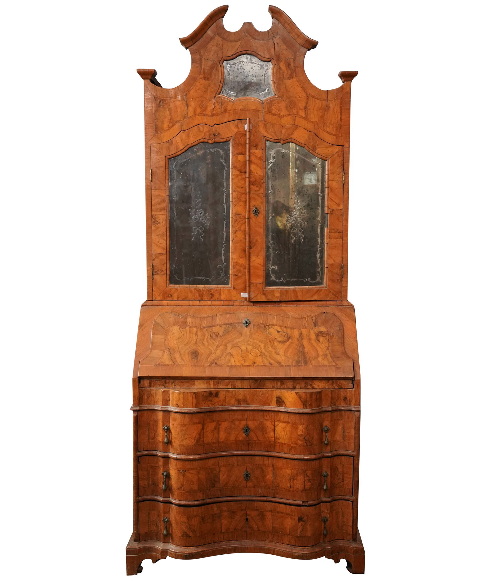 An Italian Burl Walnut Olive Wood Slant-Front Bureau: 20th century; the upper section inset with etched mirror glass panels 86 x 34 1/2 x 18 1/2 in. (218.4 x 87.6 x 47 cm.)