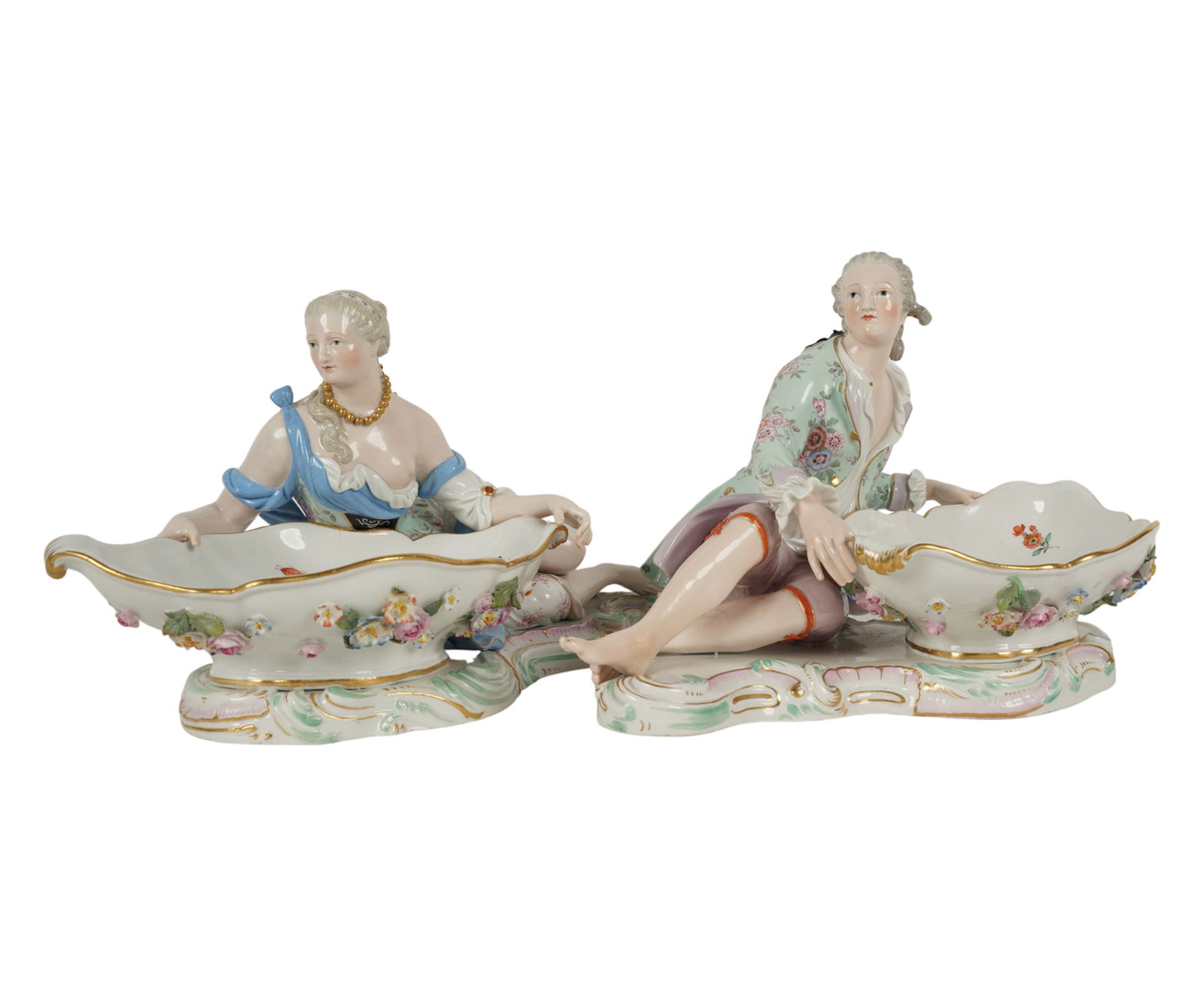 A Pair of Meissen Porcelain Sweet Meat Dishes: each with blue crossed swords mark and impressed "82"; the female incised "2858", the male incised "2863" and further impressed "163" Each 7 x 11 x 9 in. (17.8 x 27.9 x 22.9 cm.)