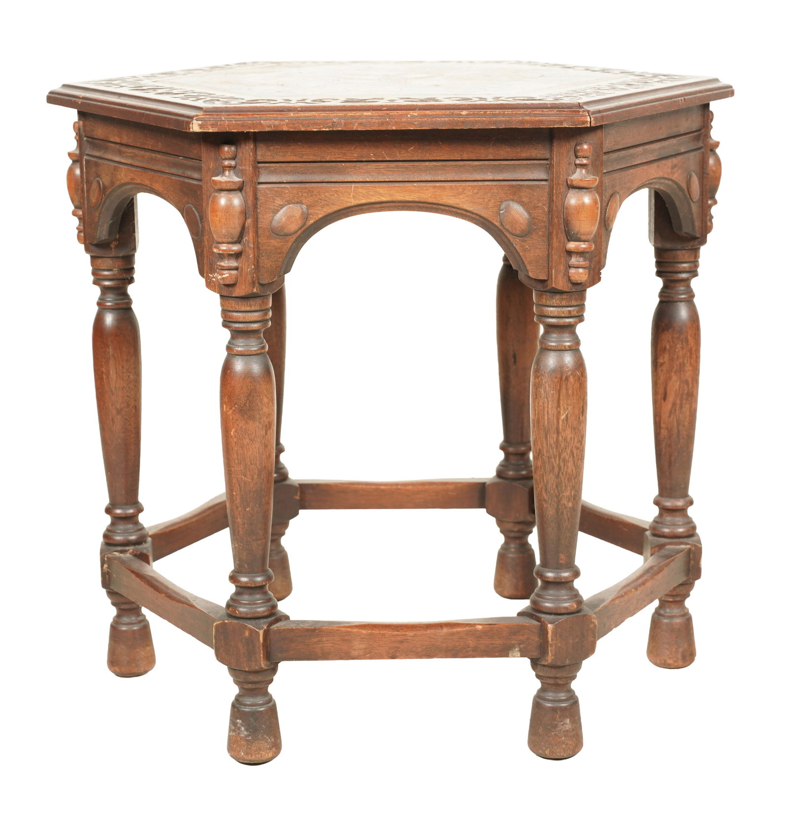 A Hexagonal Tile-Inset Carved Oak Table: second quarter 20th century; with encaustic tiles 25 x 28 1/4 x 28 1/4 in. (63.5 x 71.8 x 71.8 cm.)