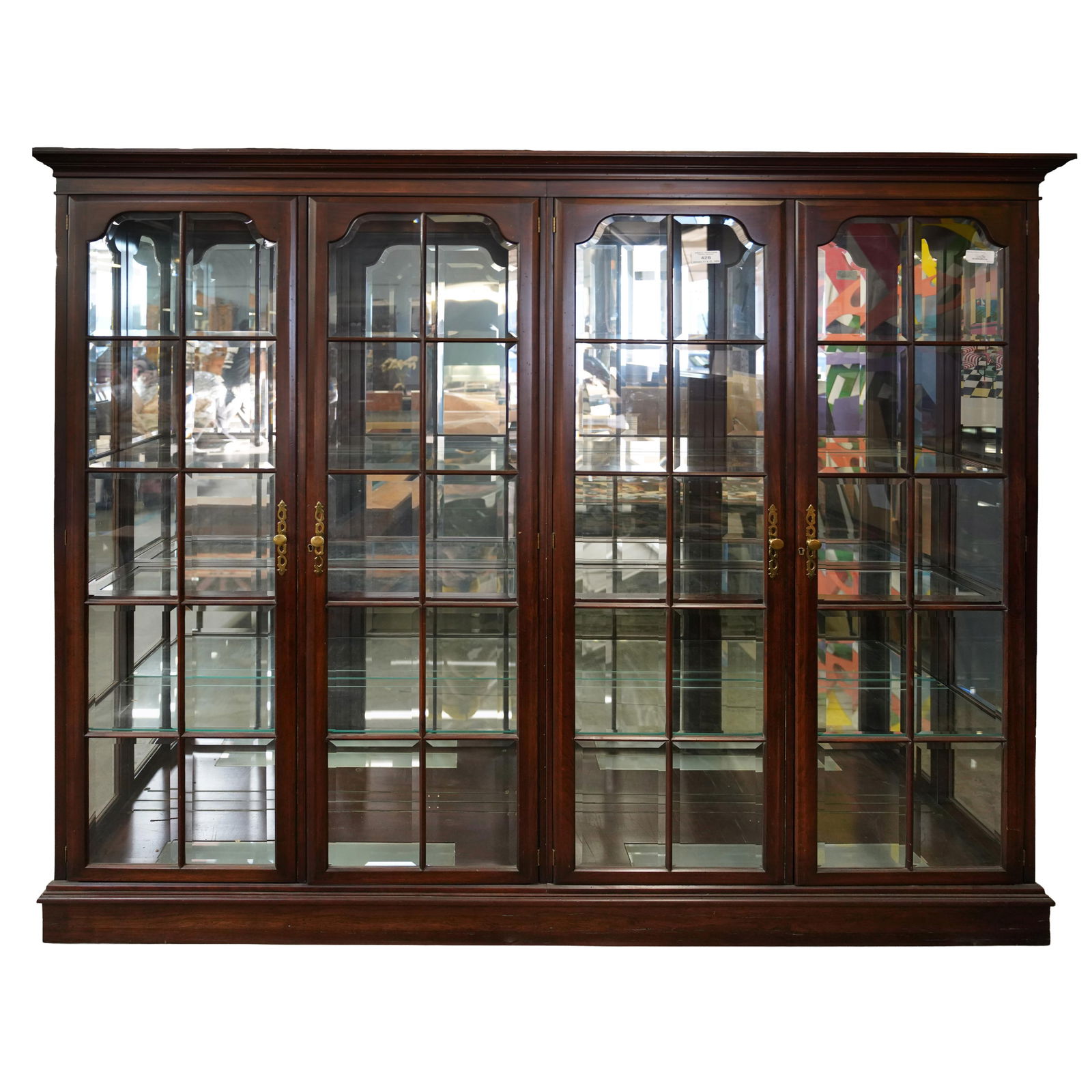 A Mahogany Display Cabinet: with beveled glass 79 x 80 x 15 in. (200.7 x 203.2 x 38.1 cm.)