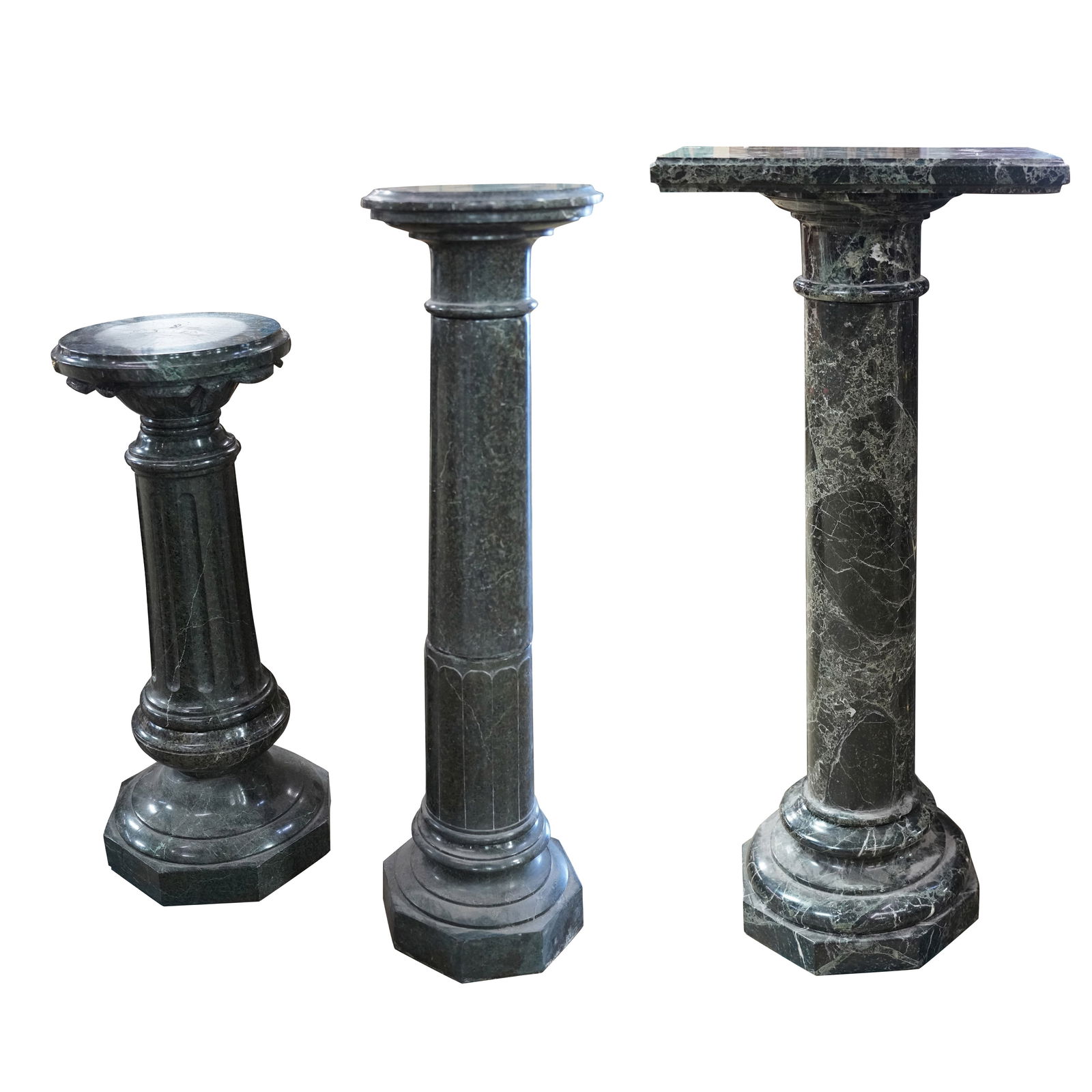 Three Green Marble Pedestals: assorted, each in multiple parts Ranging from 35 1/2 x 14 x 14 in. (90.2 x 35.6 x 35.6 cm.) to 46 x 20 x 12 1/4 in. (116.8 x 50.8 x 31.1 cm.)