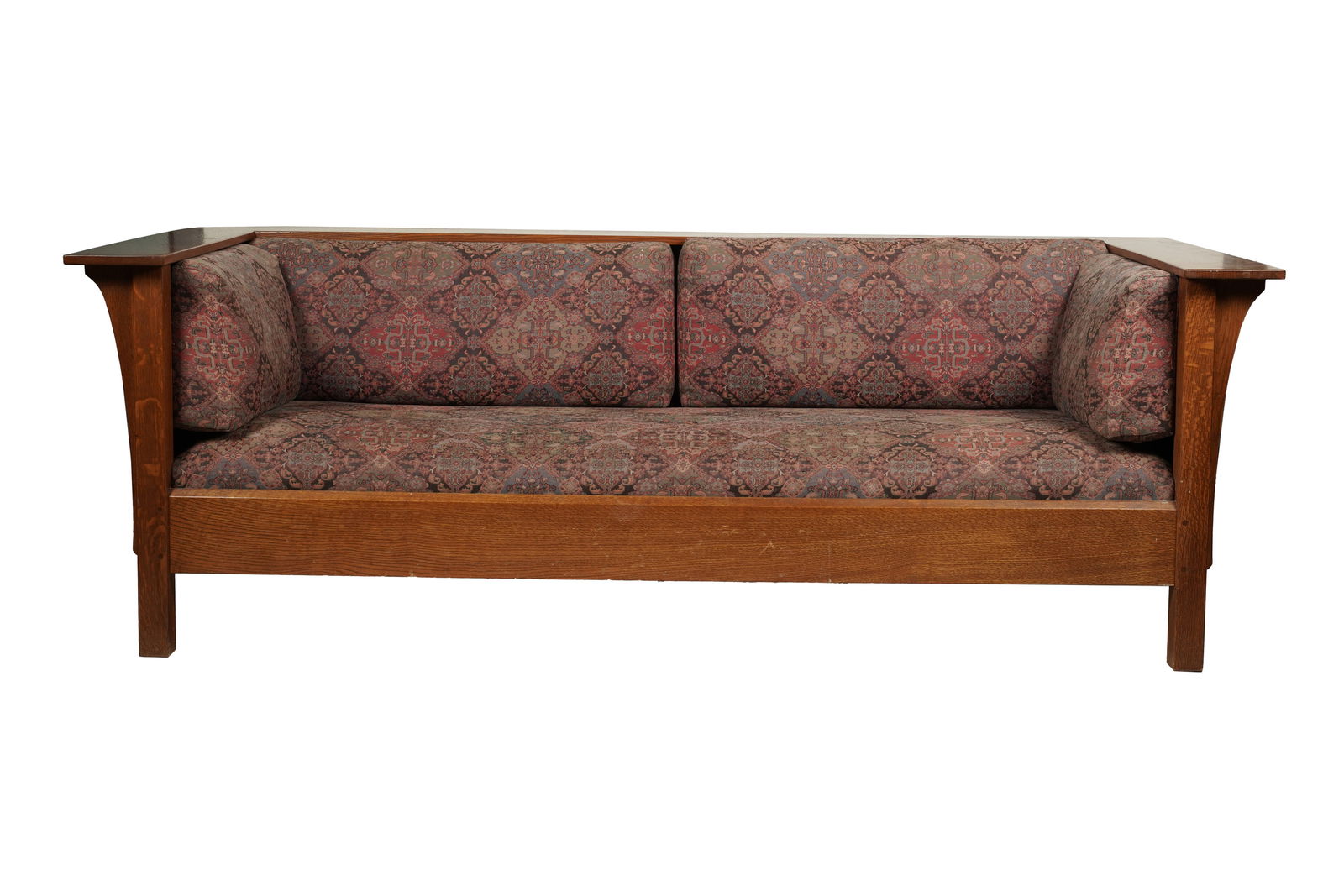 A Stickley Mission Oak Settle: late 20th century; with label 29 x 84 1/2 x 37 1/2 in. (73.7 x 214.6 x 95.3 cm.)