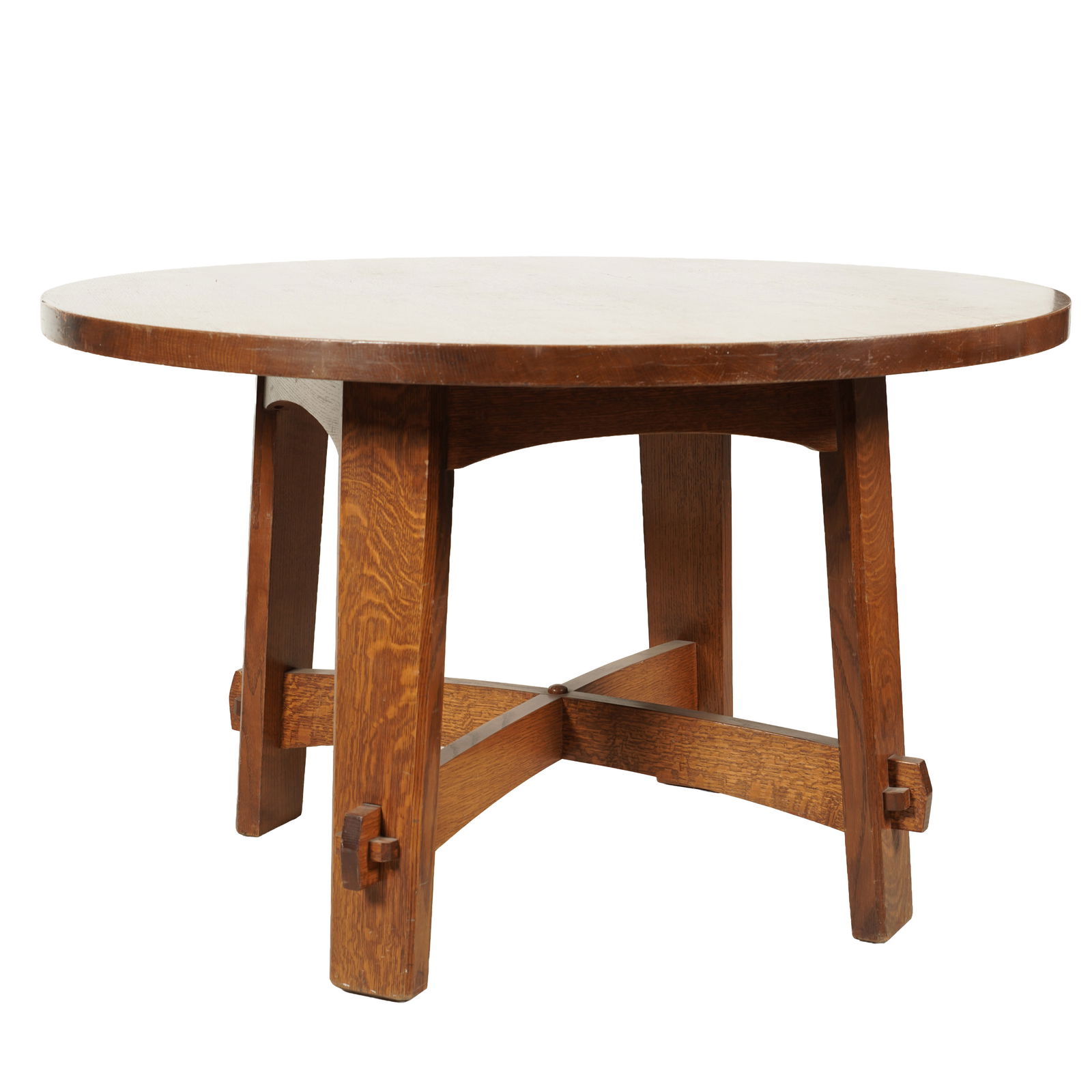 A Stickley Oak Round Dining Table: late 20th century; with label 29 1/4 x 48 in. (74.3 x 121.9 cm.)