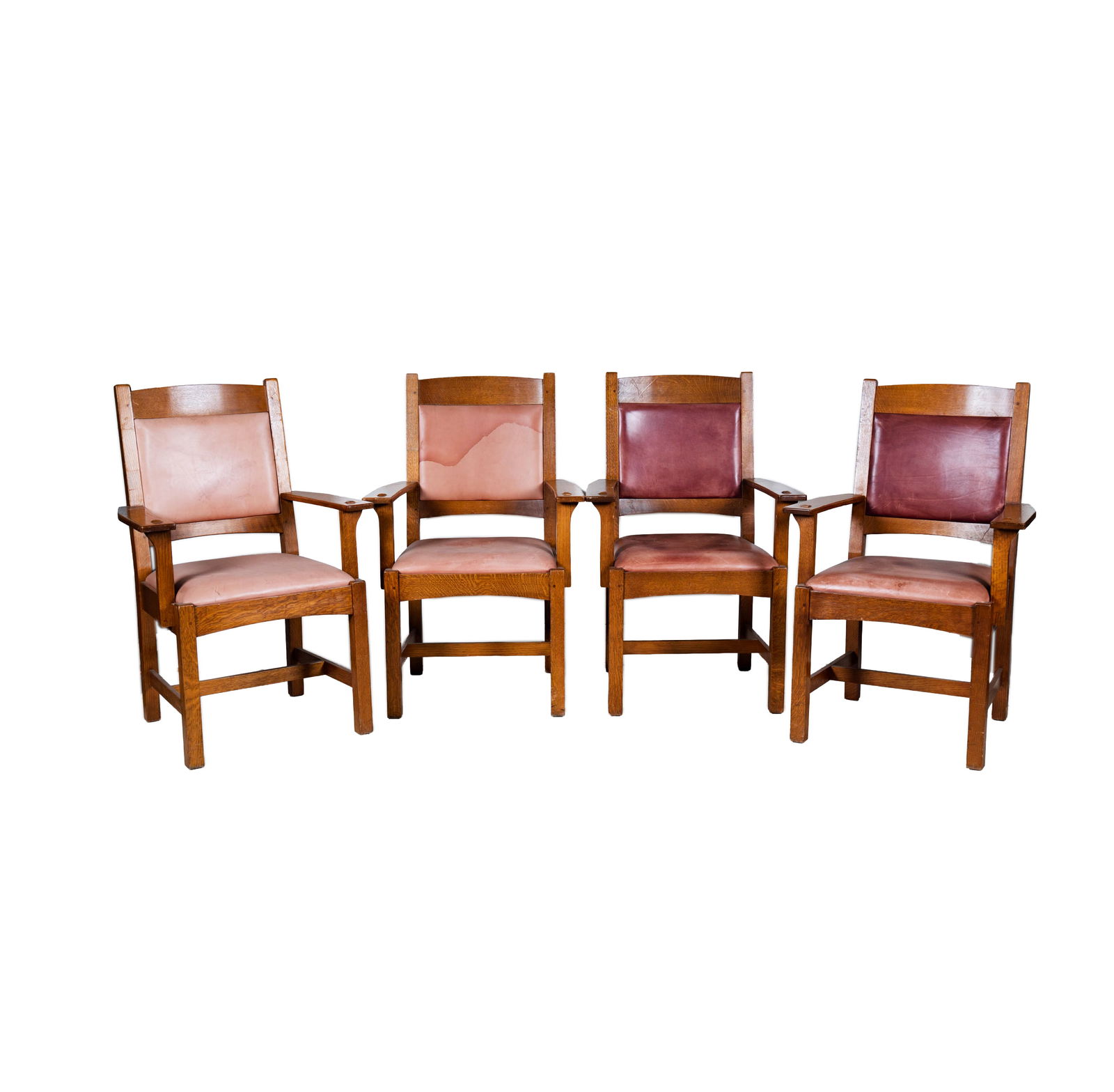 A Set of Four Stickley Oak Armchairs: late 20th century; with label 39 1/2 x 26 x 21 in. (100.3 x 66 x 53.3 cm.) Seat height: 19 in. (48.3 cm.)