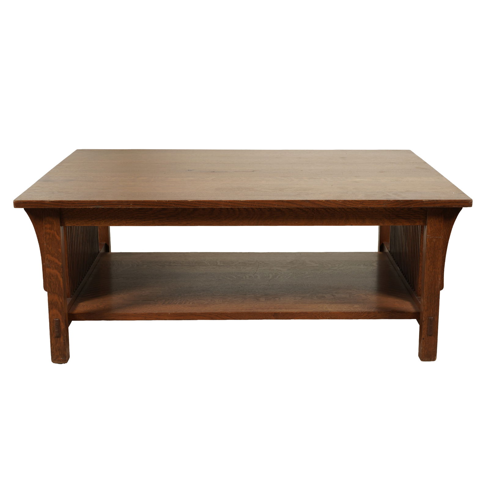 A Stickley Oak Coffee Table: late 20th century; with label 17 1/4 x 44 x 36 in. (43.8 x 111.8 x 91.4 cm.)