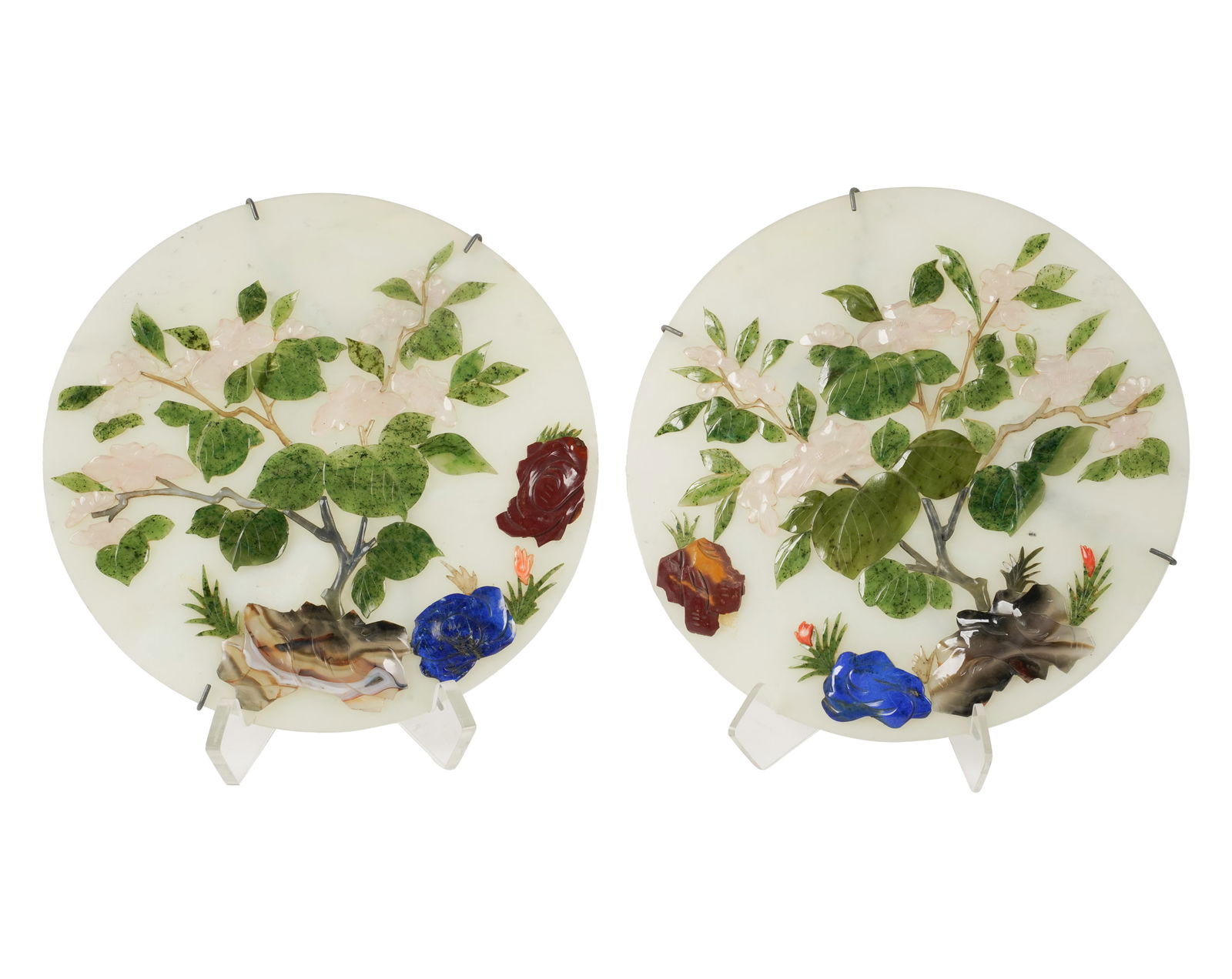 A Pair of Chinese Carved Stone Plaques: depicting flowering branches 9 in. (22.9 cm.) dia.