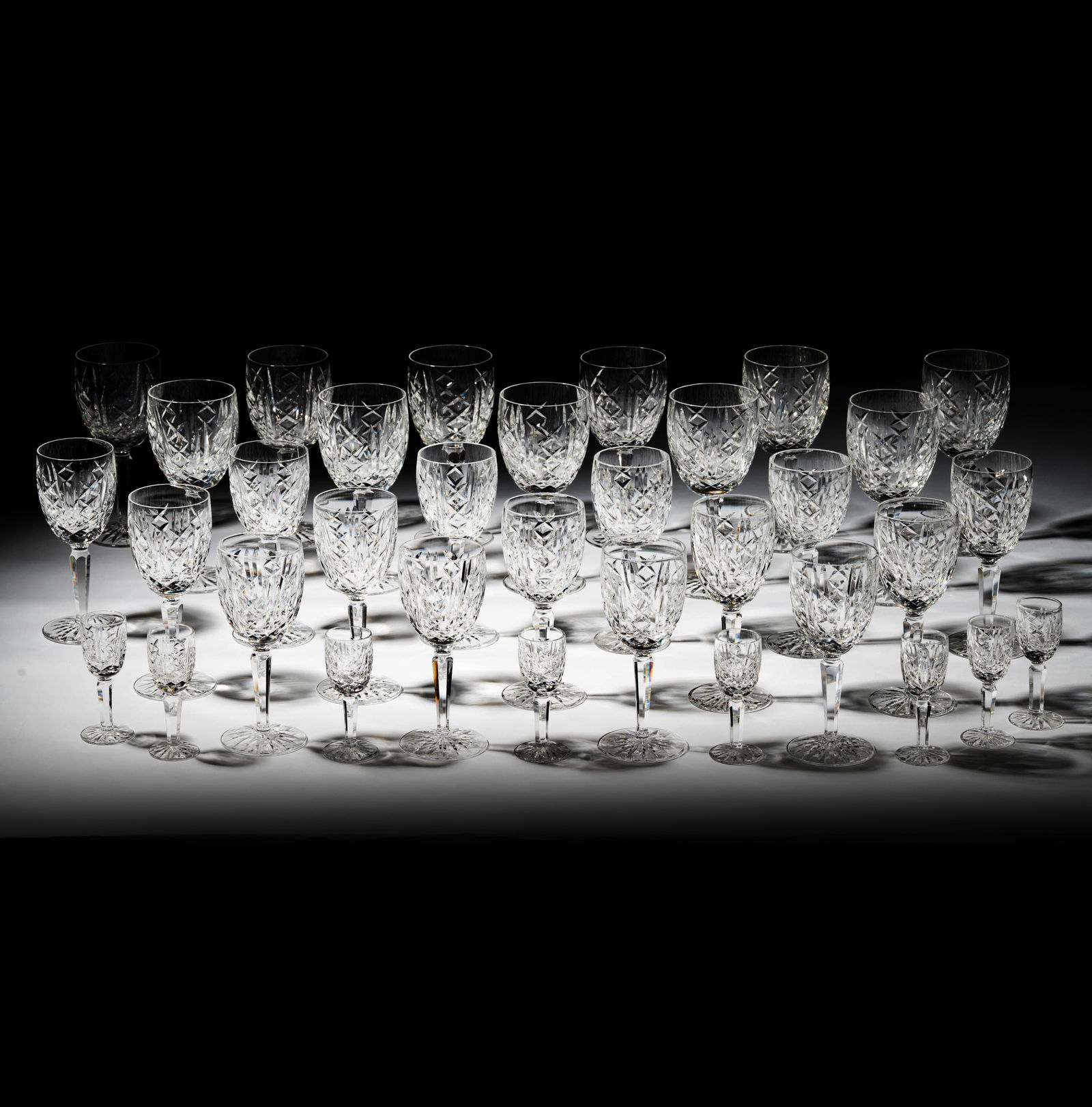 A Waterford Crystal Glengarriff Service: comprising 11 water goblets (7 in. high), 15 claret wine glasses (6 1/2 in. high), and 8 cordials (4 in. high); each marked [34 pieces]