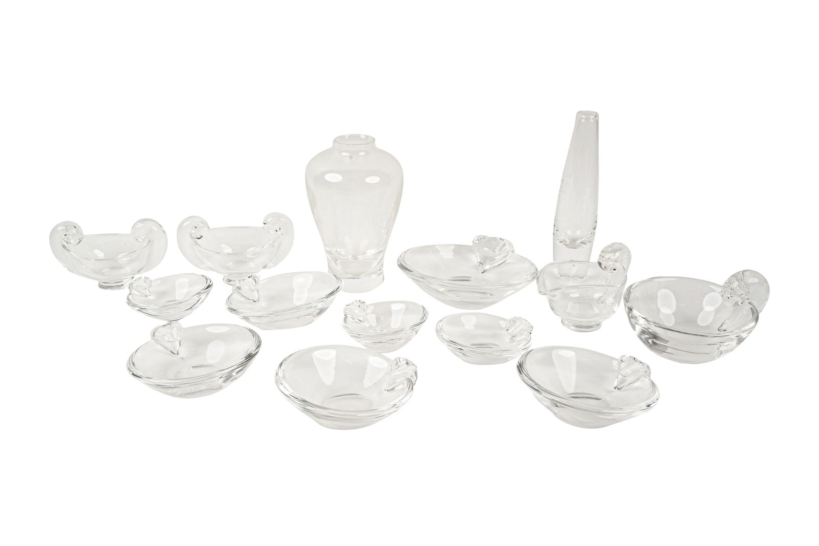 A Group of Steuben Glass: comprising two vases and 12 assorted bowls; each signed Tallest vase: 8 1/4 x 2 x 2 in. (21 x 5.1 x 5.1 cm.) [14 pieces]