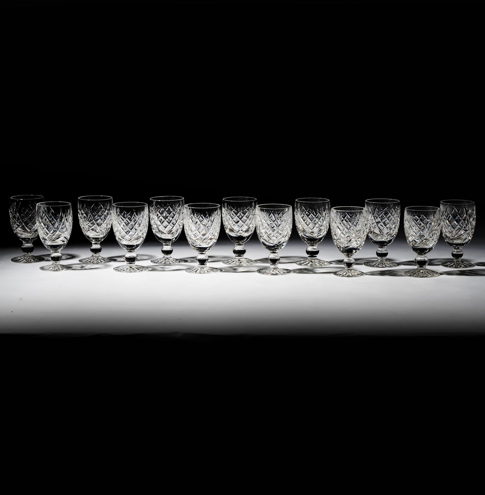 A Set of 13 Waterford Crystal Donegal Claret Wine Glasses: each marked Each 4 3/4 in. (12.1 cm.) high