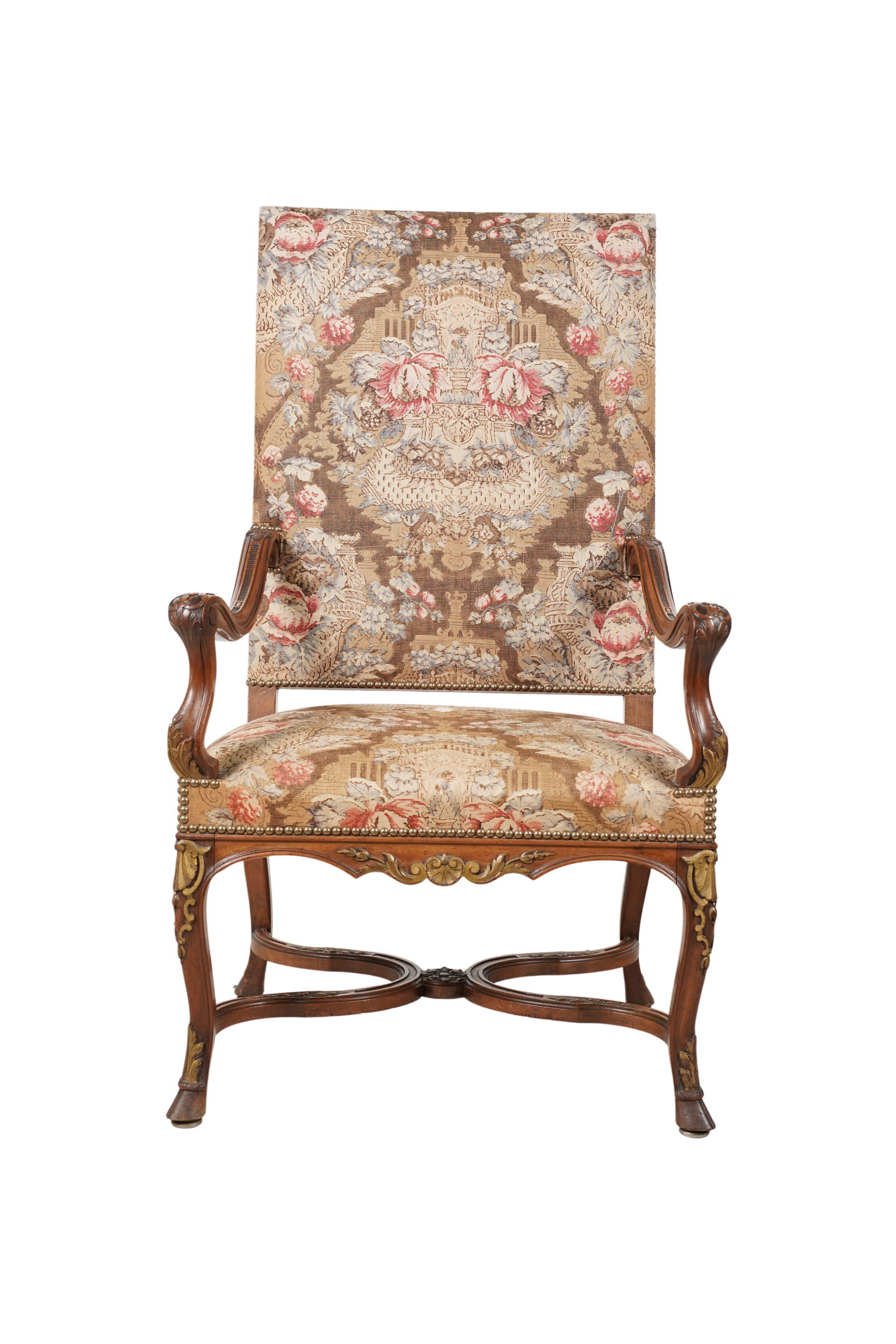 A Baroque-Style Armchair: late 20th / 21st century; the dark-stained carved wood frame with gilt accents, covered with fabric with nailhead trim 46 x 26 1/2 x 21 in. (116.8 x 67.3 x 53.3 cm.) Seat height: 18 in. (45.7 cm.)