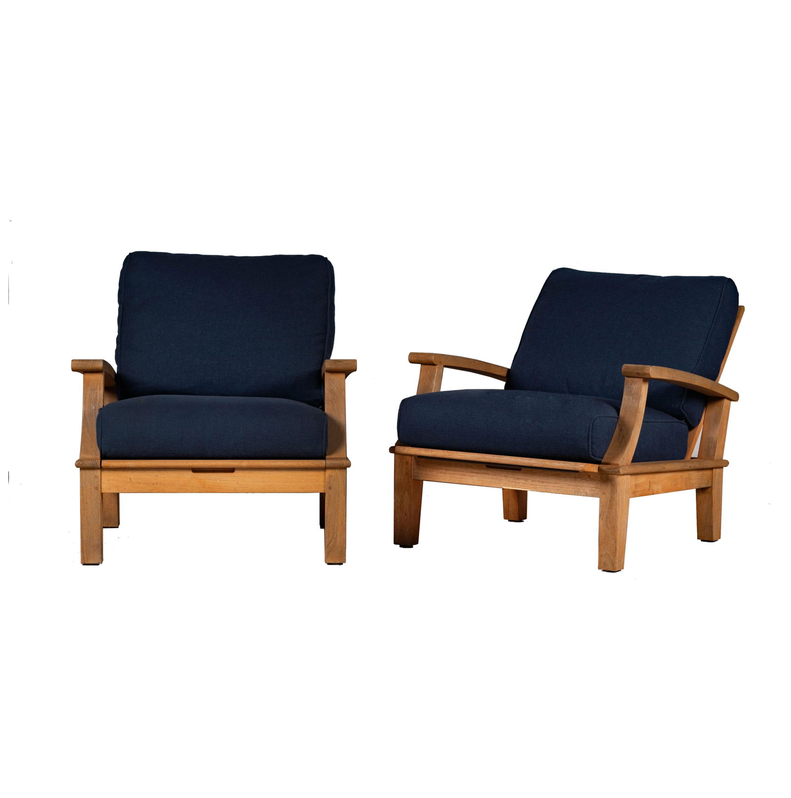 A Pair of Gloster Teak Patio Armchairs: each with reclining backrest; with manufacturer's label 31 1/2 x 31 1/2 x 31 1/2 in. (80 x 80 x 80 cm.) Seat height: 18 in. (45.7 cm.)