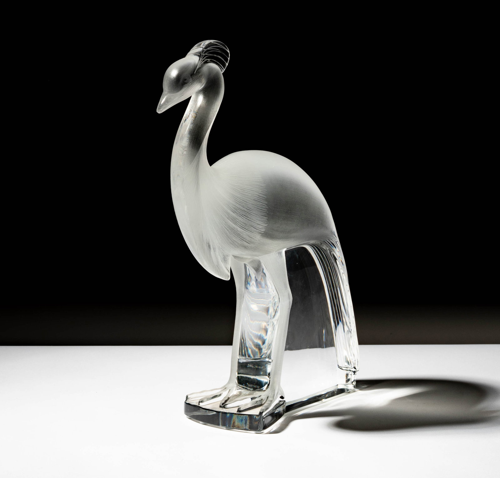 A Lalique Glass Louisiane Peacock Figure: signed "Lalique France" 13 3/4 x 11 x 4 in. (34.9 x 27.9 x 10.2 cm.)