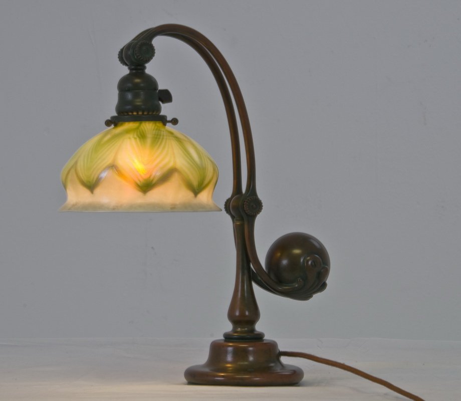 TIFFANY STUDIOS FAVRILE & BRONZE COUNTER-BALANCE LAMP: the shade inscribed L.C.T, base impressed TIFFANY STUDIOS NEW YORK 417 Provenance: Bonhams-- New York: June 11, 2009 [Lot 56031] Estate of David Copley, La Jolla 14 inches high; the shade measuring 6 