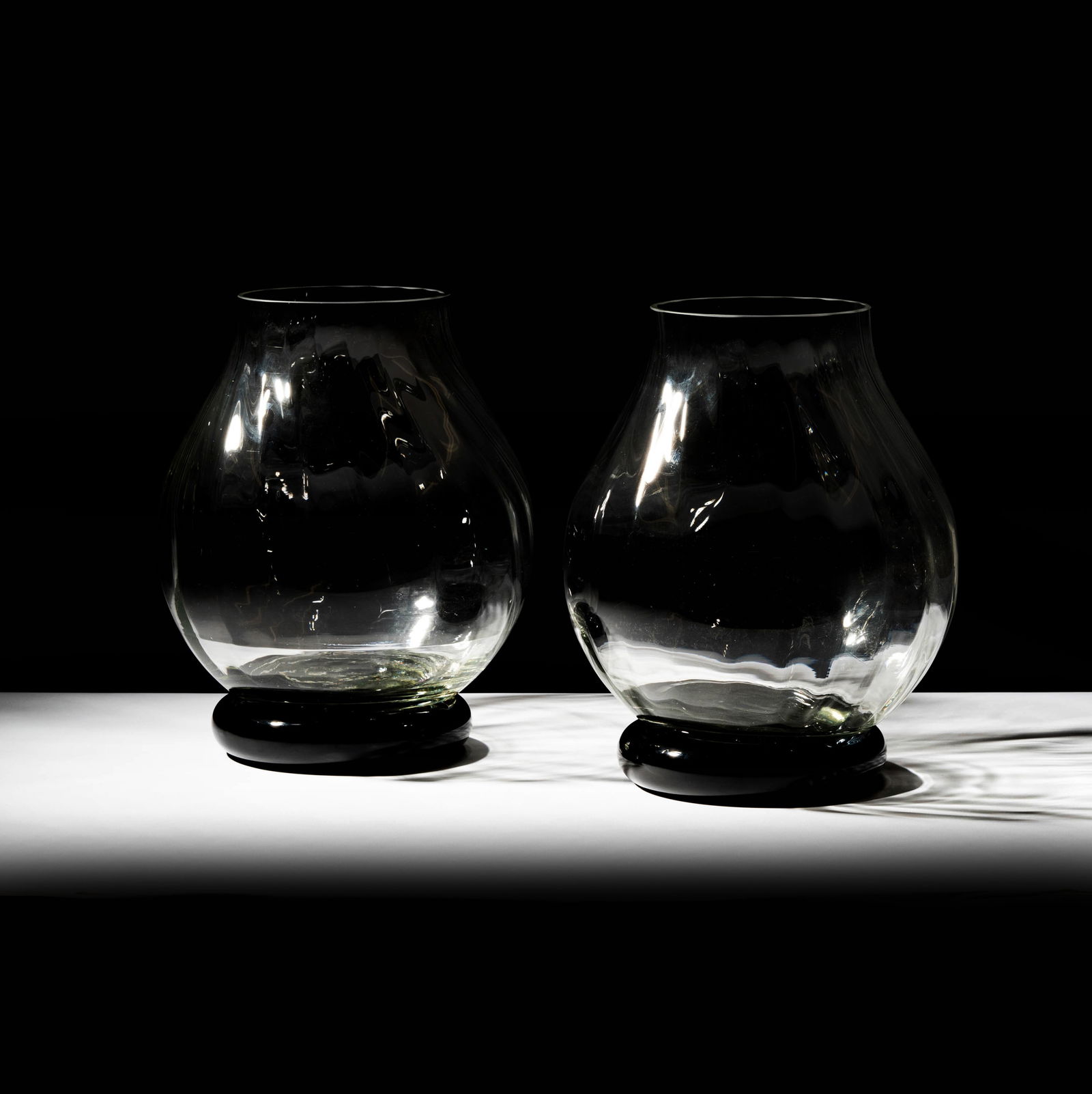 Pair of Modern Glass Vases: the vases unsigned, each removable from black porcelain base, each base with label for Balos, Japan, Total size: 15 x 11 in. 