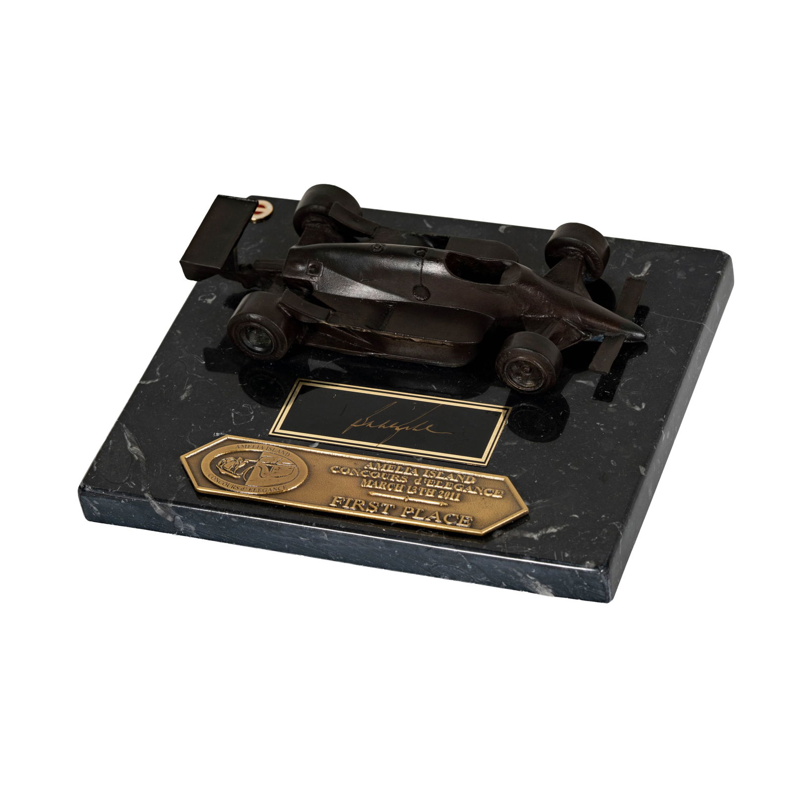 Amelia Island Concours d'Elegance Award: First Place trophy depicting a race car, Total size: 2 x 8.5 x 7.25 in. 