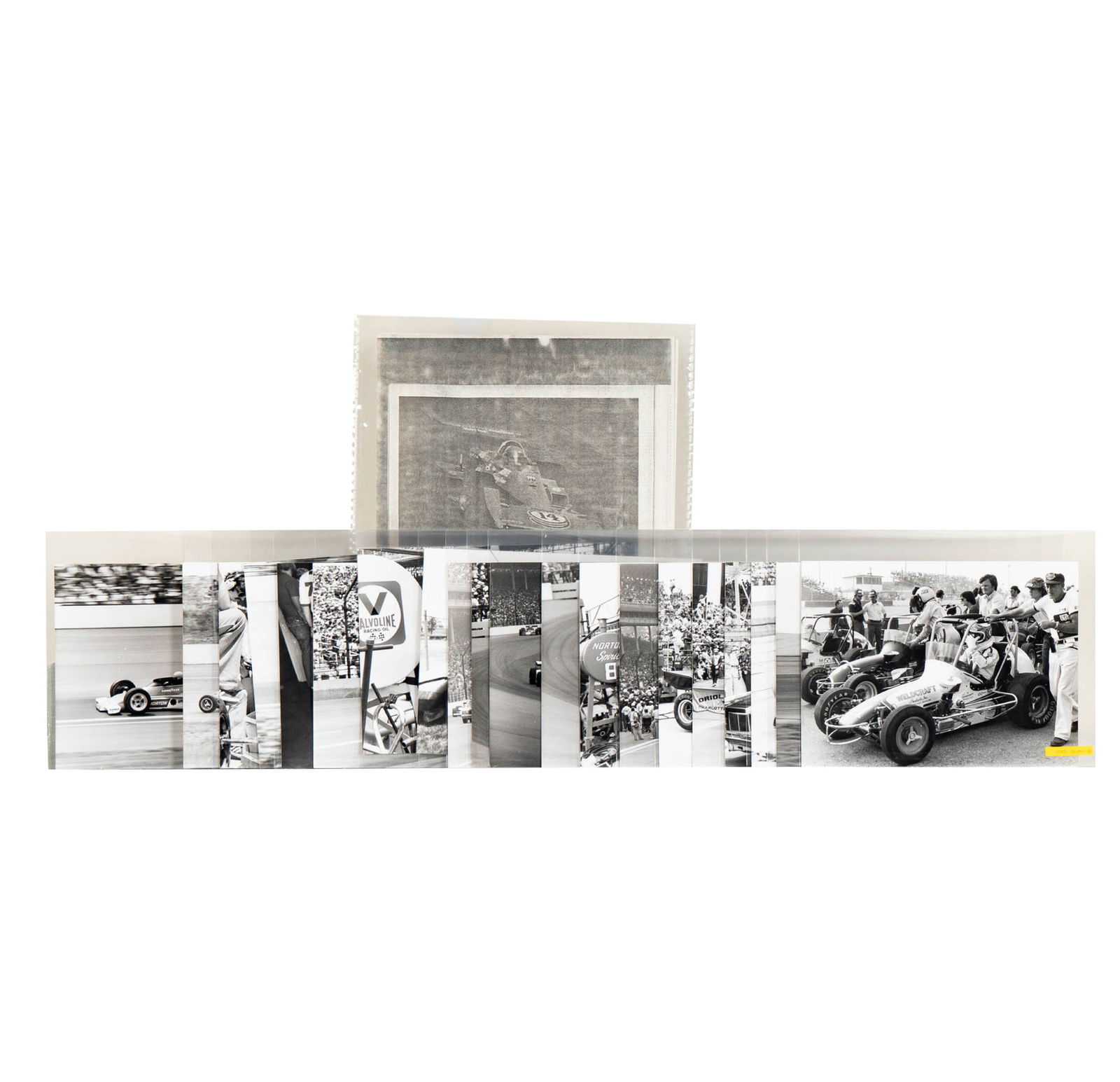 20 Black and White Photos from the Indianapolis 500: each black and white, each stamped Copyright J.P. Caron, together with an article from Autosport dated June 9, 1977, "Four for Foyt-Finally", Each photograph: 7 x 9 inches