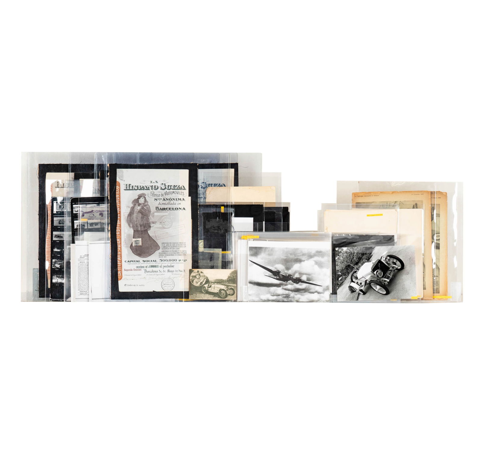 Group of Hispano Suiza Collector's Items: many items, including various black and white photographs, 24 strips of negatives, 20 transparancies, 14 proof sheets, magazines, booklets, six Hispano Suiza stock certificates, etc.
