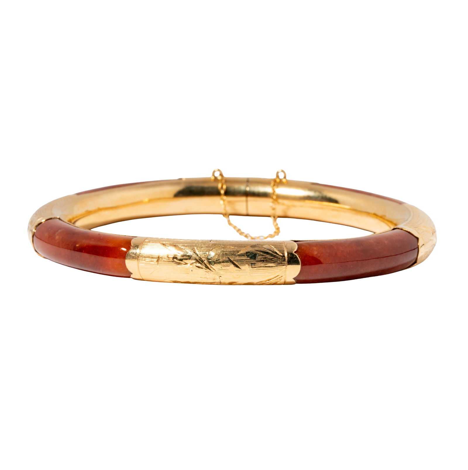 14 Karat Yellow Gold Jade Bangle: Including one gold accented jade bangle measuring 1/4 inch in width and inside circumference measuring 7 inches; weighing 23.4 grams