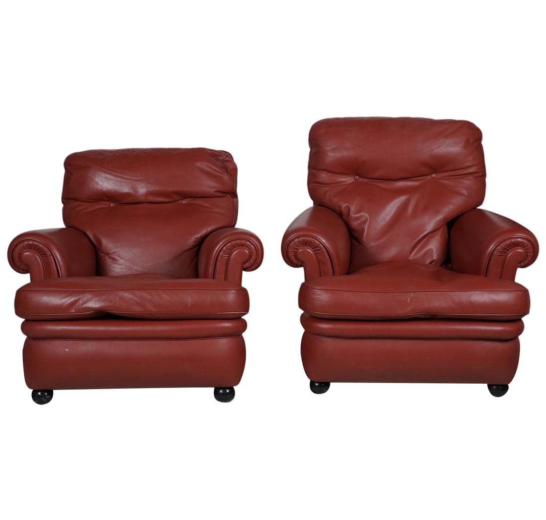 Pair of Poltrona Frau Red Leather Club Chairs: each with manufacturer's logo to decking, Each 33 x 35 x 35 in., Seat height: 16 in.