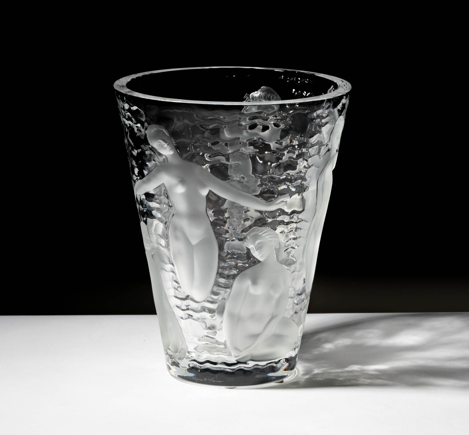 A Lalique Molded Glass Ondines Vase: 9 3/8 x 7 1/2 in. (23.8 x 19.1 cm.),