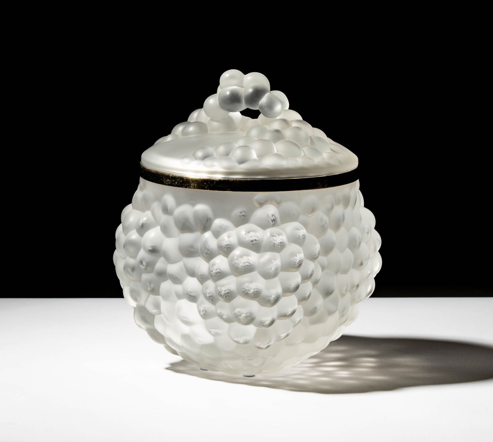 A Lalique Antilles Glass Ice Bucket: with original lid; signed "Lalique France", 10 x 7 in. (25.4 x 17.8 cm.),