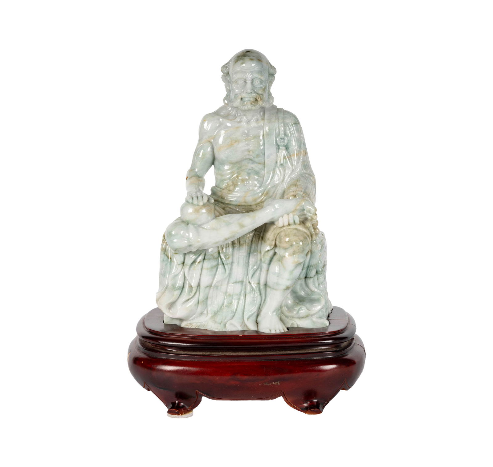 A Chinese Carved Jade Figure of Ji Gong: the solid mottled green jade set into a fitted stand, 11 x 7 x 5 1/2 in. (27.9 x 17.8 x 14 cm.),