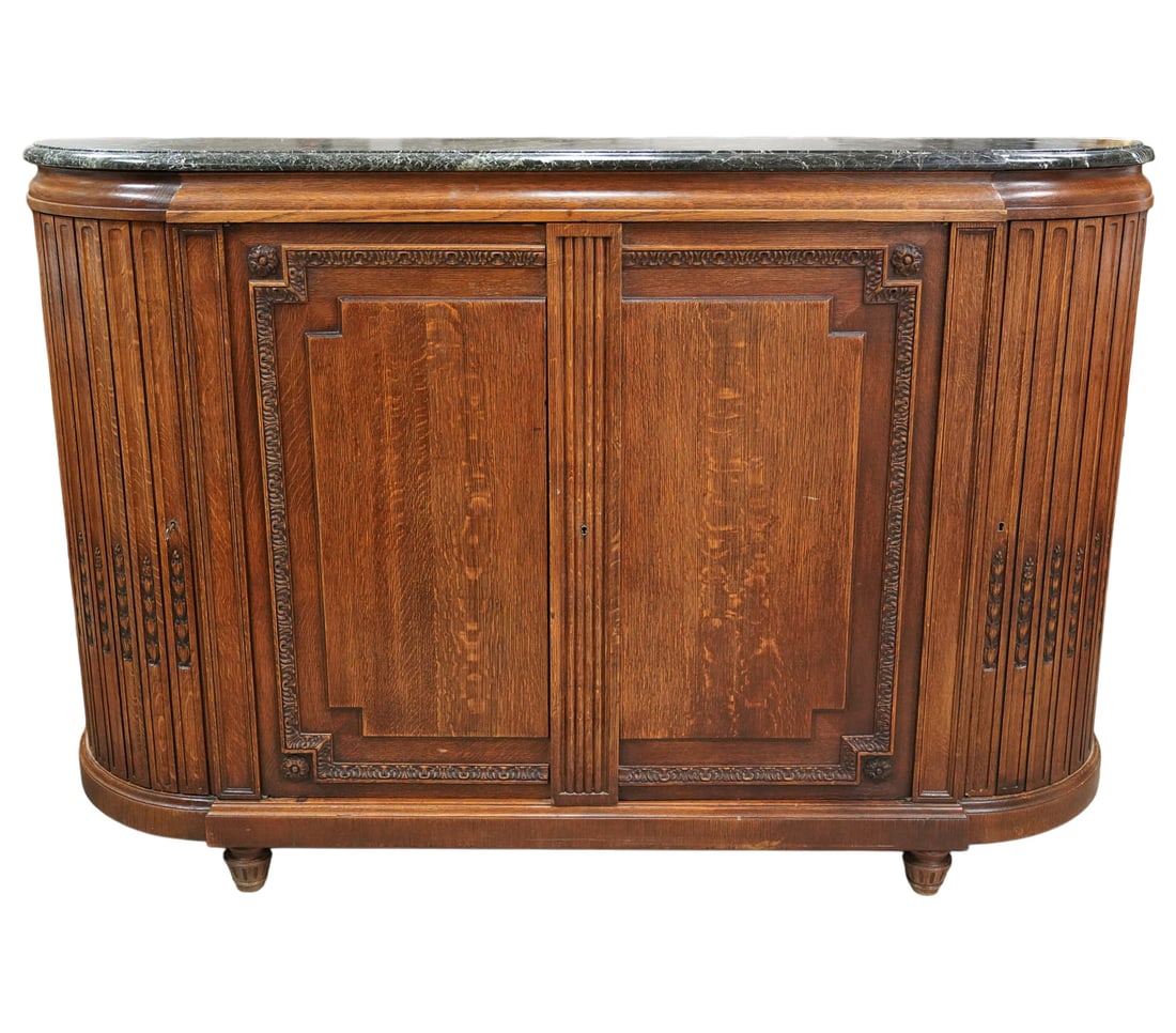 French Carved Oak Marble-Top Enfilade: c. 1900; D-shaped, with two doors flanked by two curved, fluted doors carved with bellflowers, 51 1/2 x 76 x 14 1/2 in.