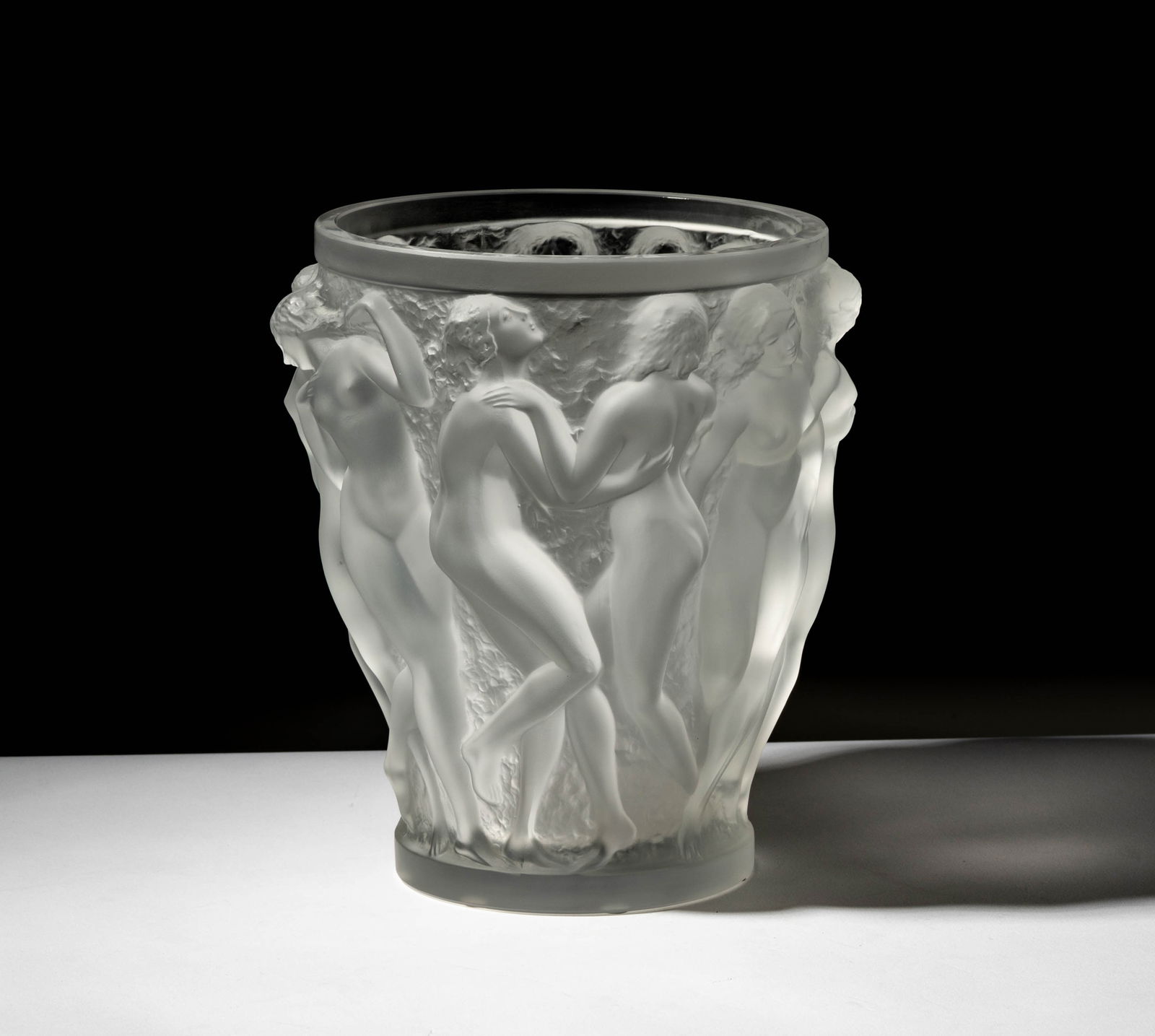 A Lalique Molded Glass Bacchantes Vase: 9 1/2 x 8 in. (24.1 x 20.3 cm.),