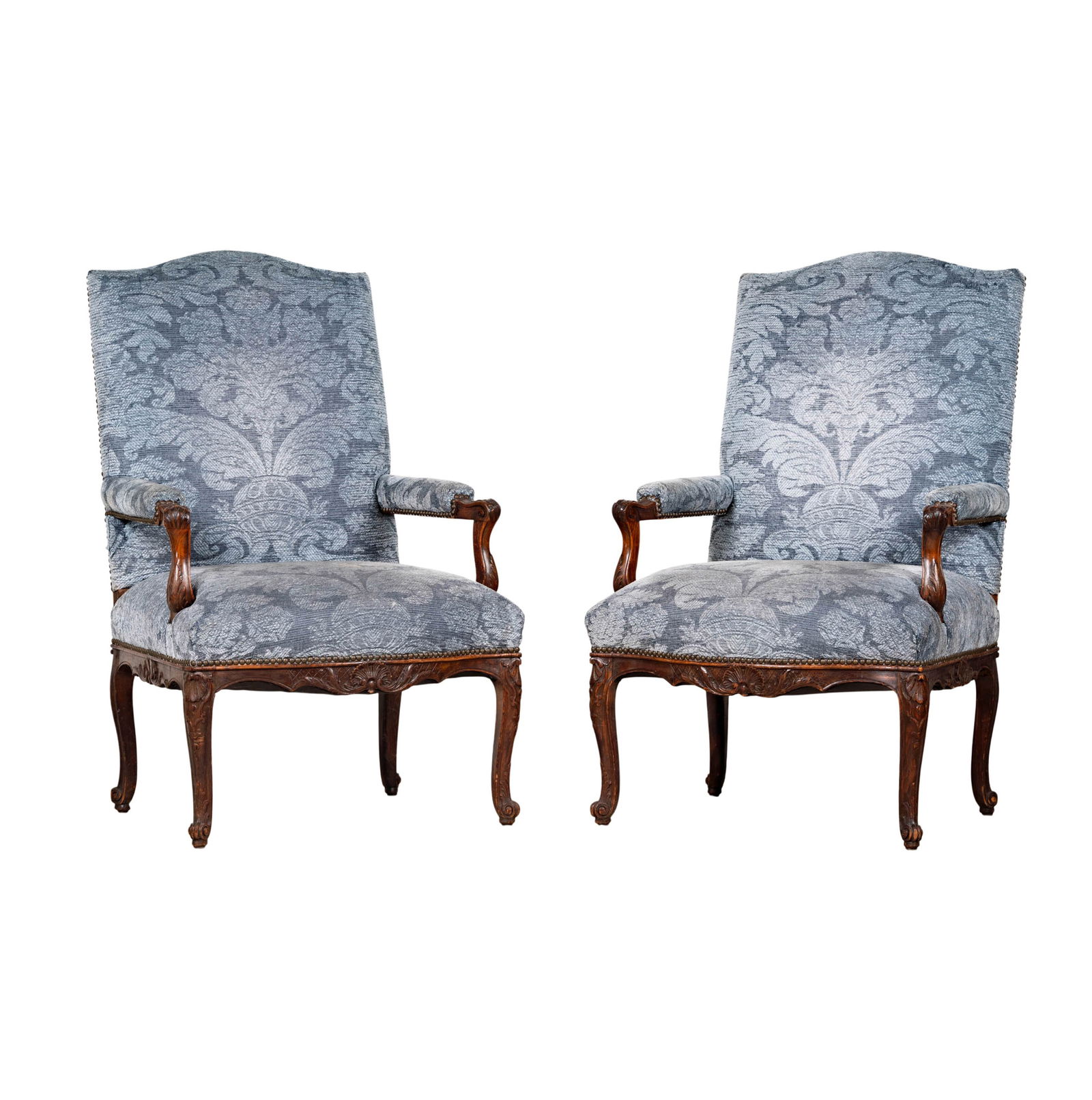 A Pair of Regence-Style Carved Fruitwood Fauteuils: antique, covered with later grey fabric, 43 1/2 x 27 x 25 in. Seat height: 17 1/2 in.