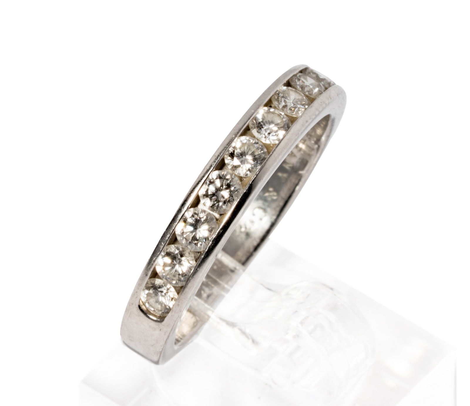 Tiffany & Co., Platinum, Diamond Wedding Band: Including one Tiffany Co.platinum diamond wedding band, set with 10 diamonds [G/VS1-2] weighing approximately 1 carat total; size: 9-1/2, weighing 8.2 grams;