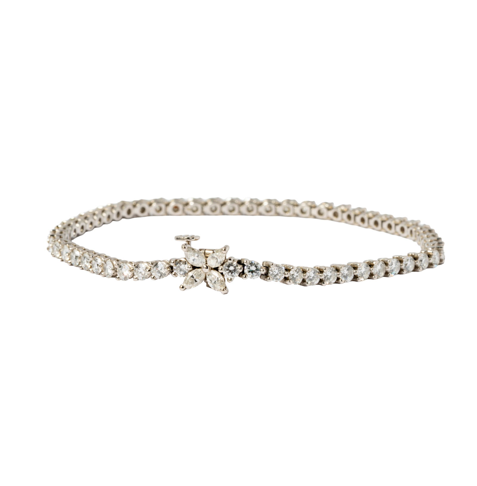 Tiffany & Co. Platinum and Diamond “Victoria?? Tennis Bracelet: Containing 55 full-cut diamonds [F-G/VVS-VS] weighing approximately 3.00 carats total; and four marquise modified brilliant-cut diamonds [F-G/VVS-VS] weighing approximately 0.30 carats total; measurin