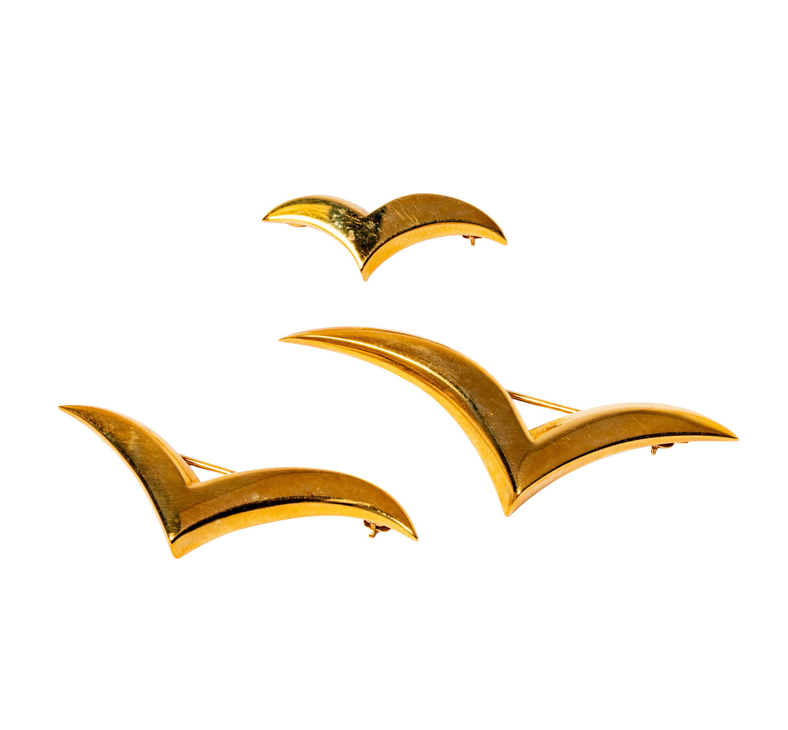 Three Tiffany & Co. Paloma Picasso 18 Karat Yellow Gold “Seagull?? Pins: Including three seagull pins, largest measuring 2 inches wide and smallest measuring 1-1/8 inches wide, together weighing 14.4 grams;