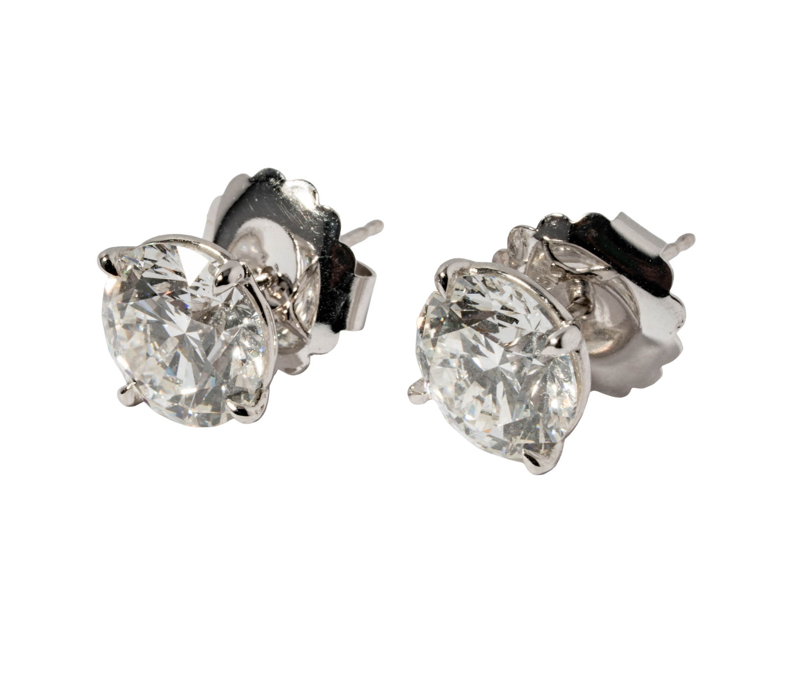 Pair of Diamond Stud Earrings: 3.00 carat [G/VS2] and 3.01 [G/VS2]; both are triple-excellent cut quality)