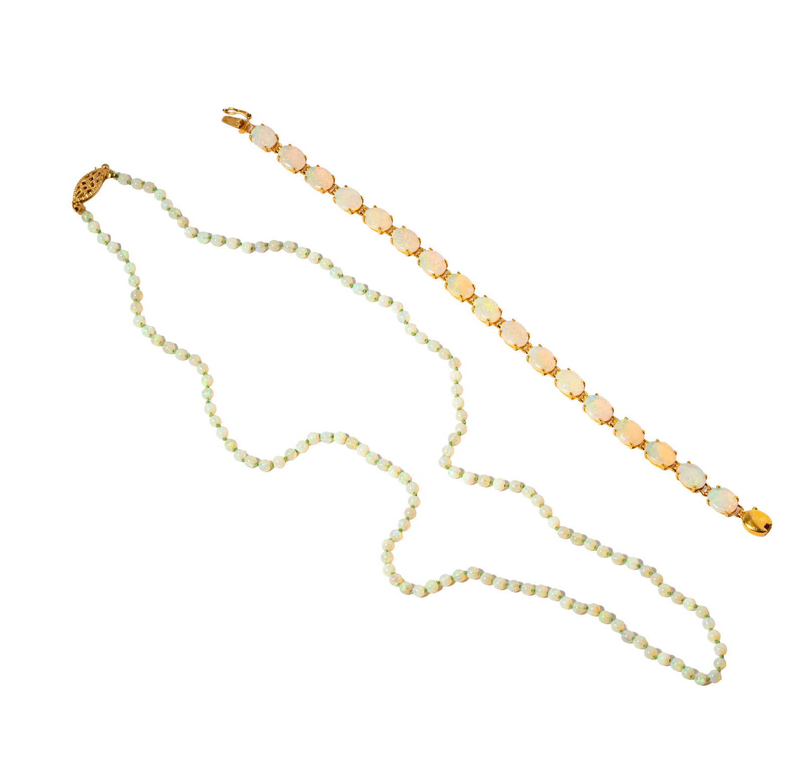 14 Karat Yellow Gold and Opal Necklace and Bracelet: Including one opal oval cabochon bracelet set with 17 opals weghing approximately 5.10 carats, bracelet measuring 7 inches long, and weighing 6.6 grams; with one opal beaded necklace, opal beads