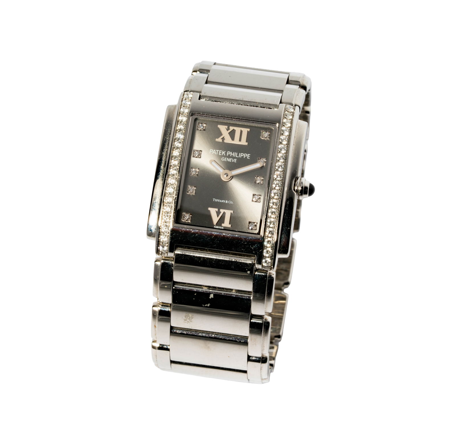 Phillip Patek Stainless Steel Twenty-4 Watch: Including one Patek Philippe stainless steel and diamond; set with 46 small round full-cut diamonds weighing approximately 0.60 carats; case with crown measuring 28.6mm wide, bracelet measuring 6 inch