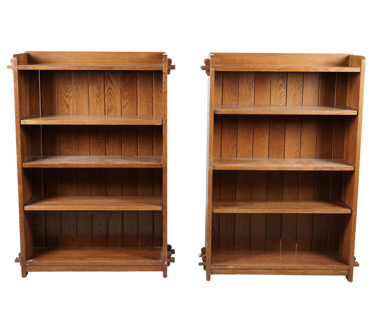 A Pair of Stickley Oak Bookshelves: signed, with adjustable shelves, 55 x 40 x 12 in.