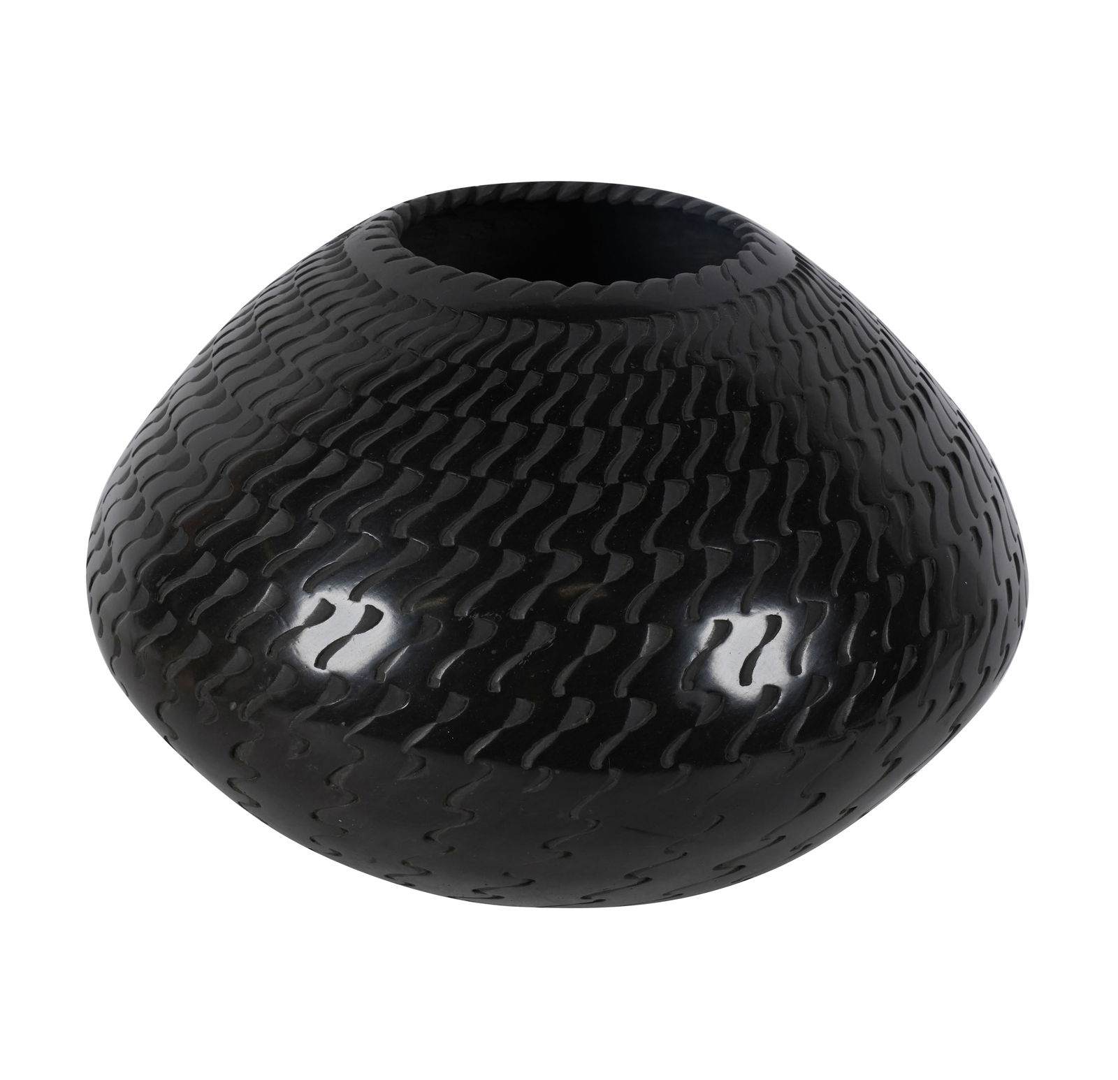 A Mata Ortiz Blackware Jar by Reynaldo Quezada: signed to underside, 7 1/2 x 9 1/2 in.