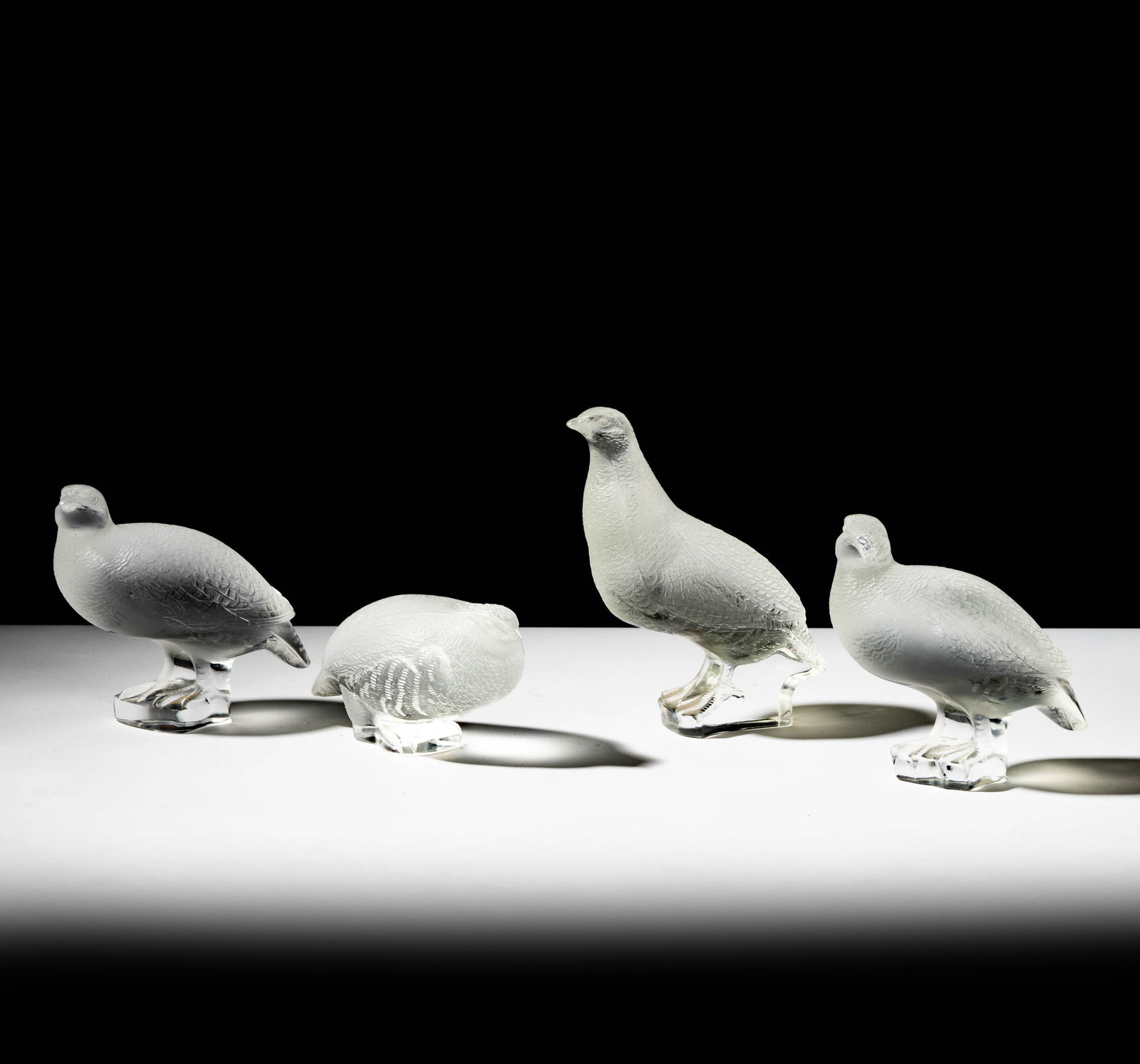 Four Lalique Quail Figures: each signed, Tallest: 7 in. high, Shortest: 3 in. high