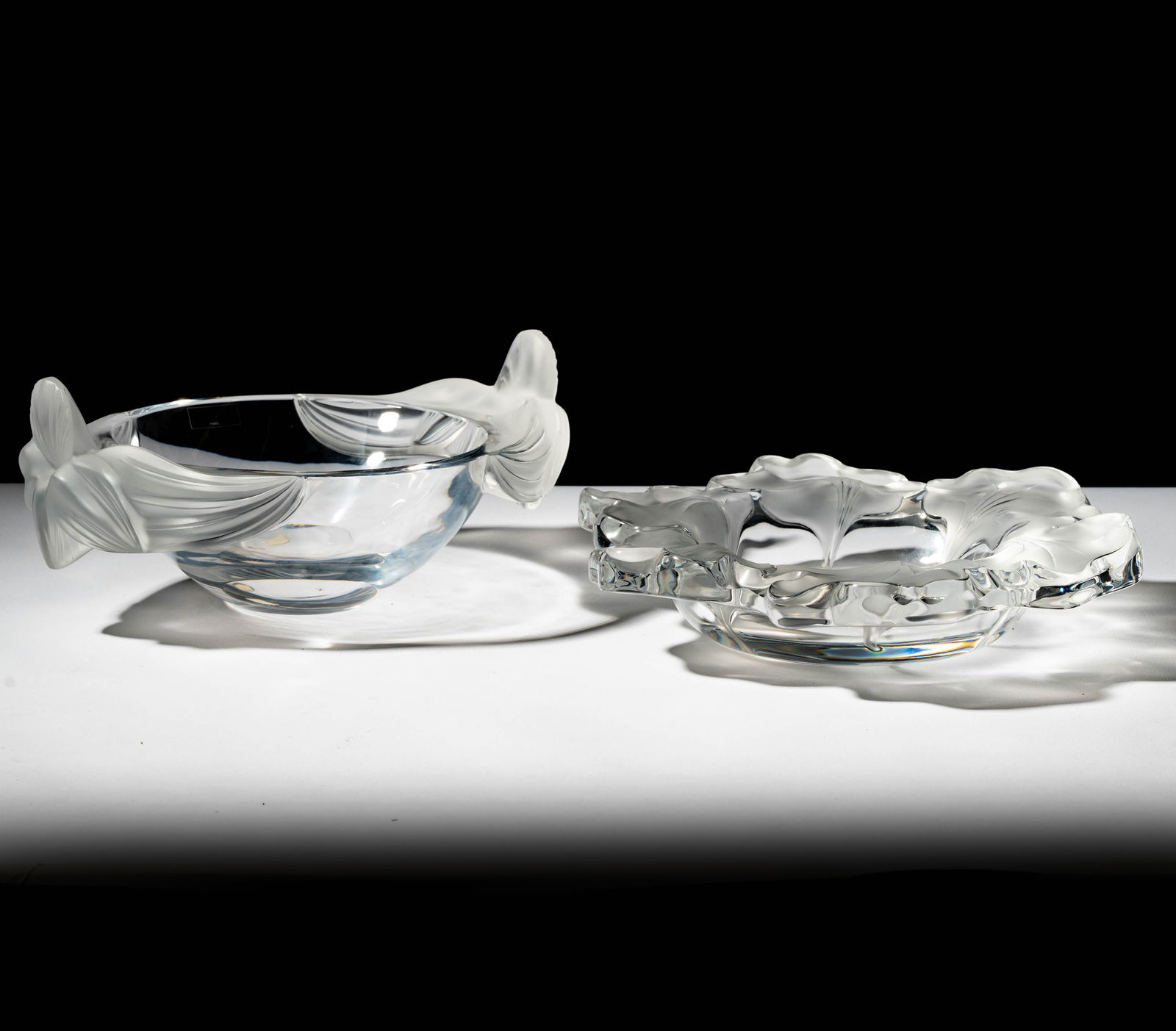 Lalique Capucines and Loriol Crystal Bowls: each signed, tallest: 5 1/2 x 13 x 8 3/4 in.