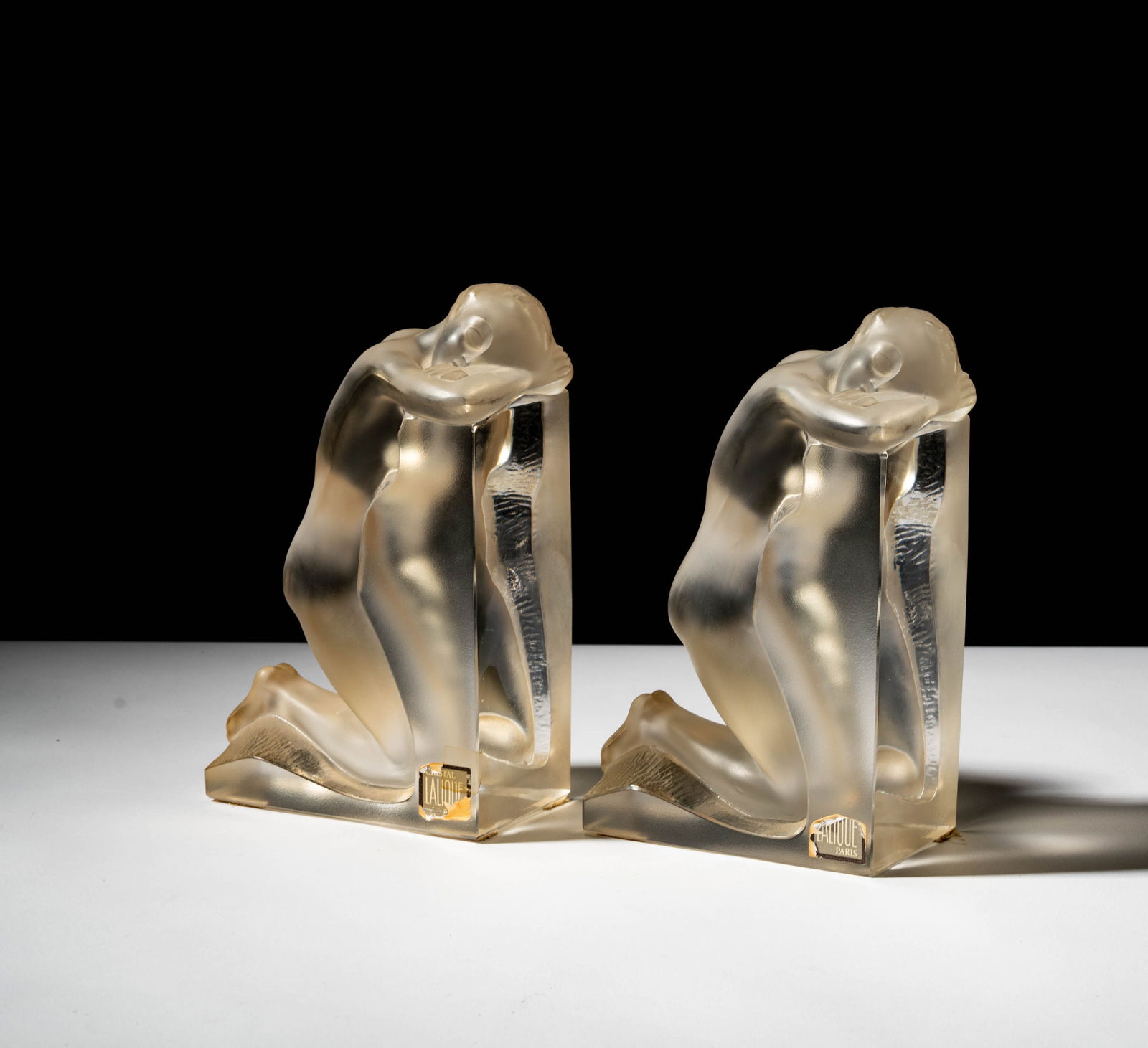 Pair of Lalique Reverie Female Nude Bookends: each signed, 8 3/4 x 5 1/2 x 3 1/2 in.