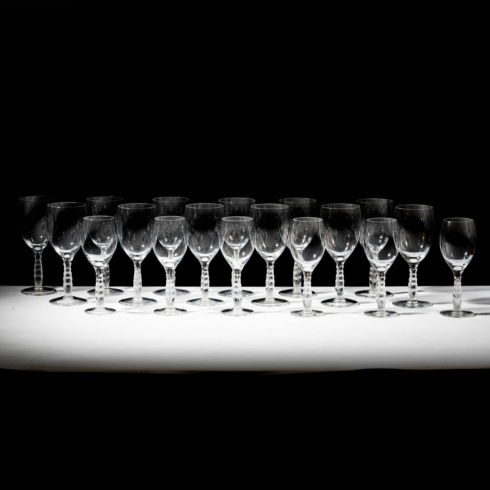 Set of Lalique Crystal Kentia Stemware: each signed, 25 pcs. comprising 11 small, 14 larger glasses., 8 x 3 1/4 in.