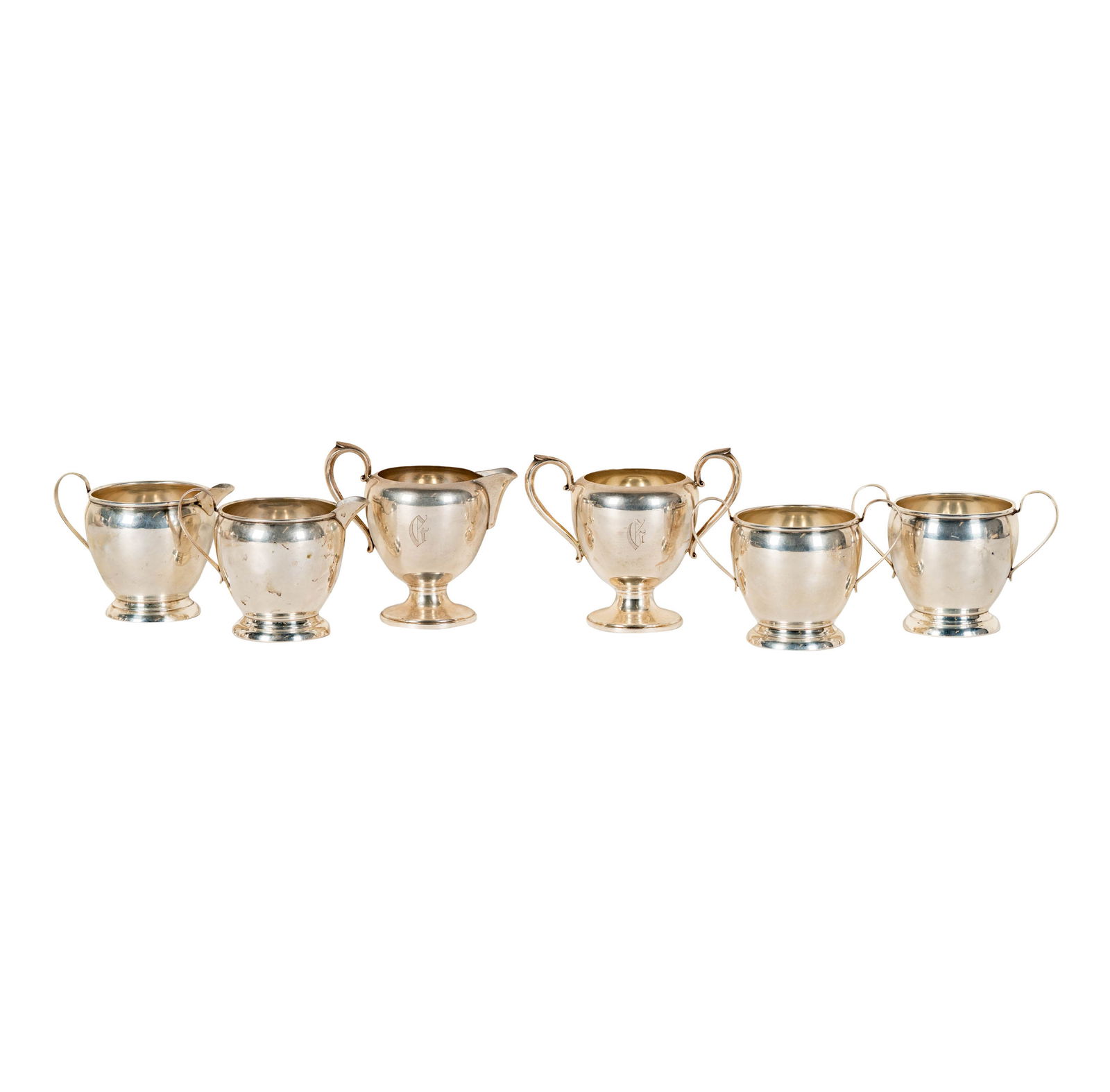 Six Assorted Sterling Creamers and Sugars: tallest: 4 1/4 x 5 1/2 x 3 in., creamer: 4 1/4 x 4 3/4 x 3 in., approximately 561 grams
