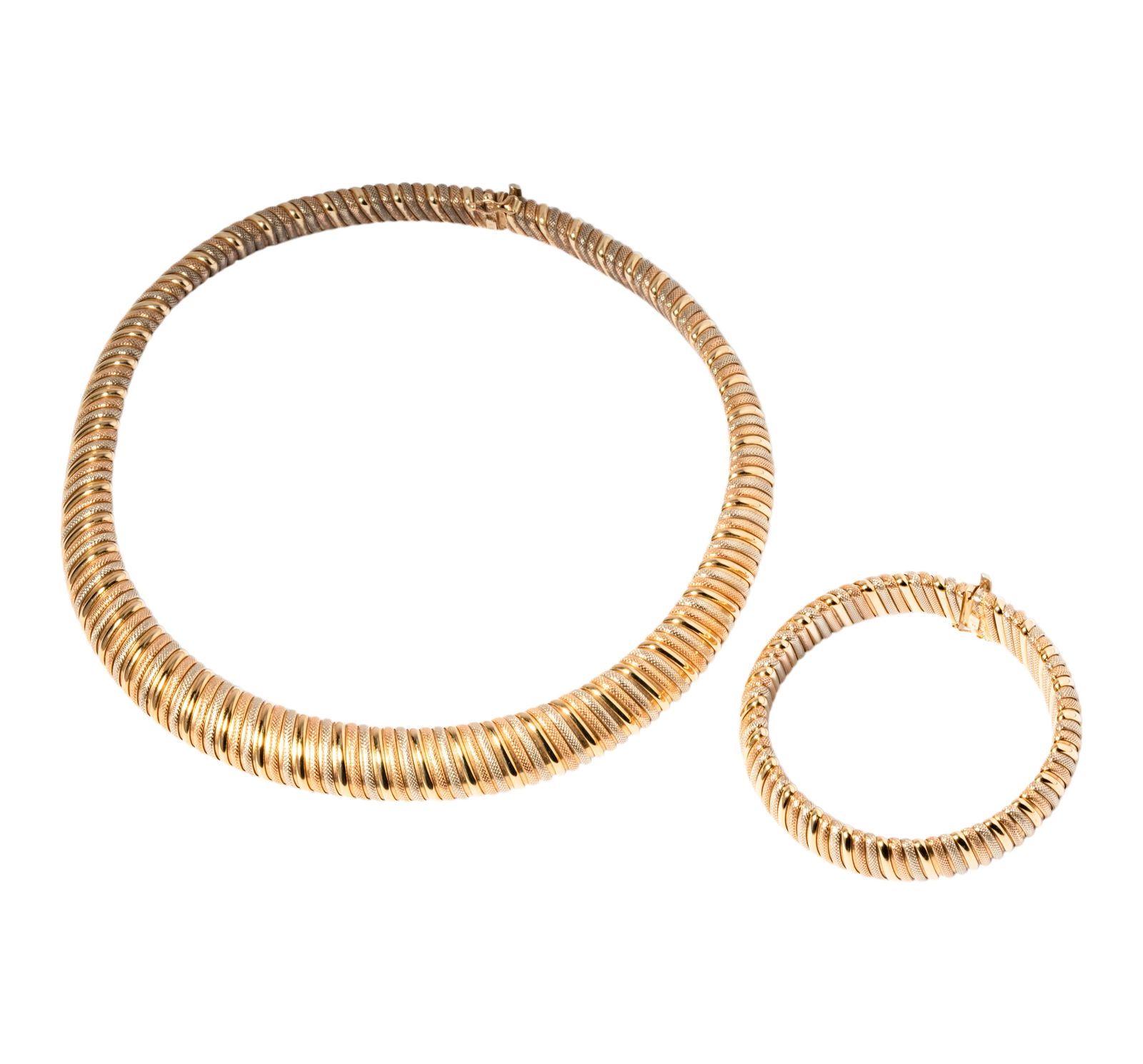 14 Karat Tri-Color Gold Necklace and Bracelet: Including one tri-color necklace with matching bracelet, necklace measuring about 15-1/4 inches long and bracelet measuring 7-1/4 inches long by 1/2 inch wide, weighing 107.2 grams;