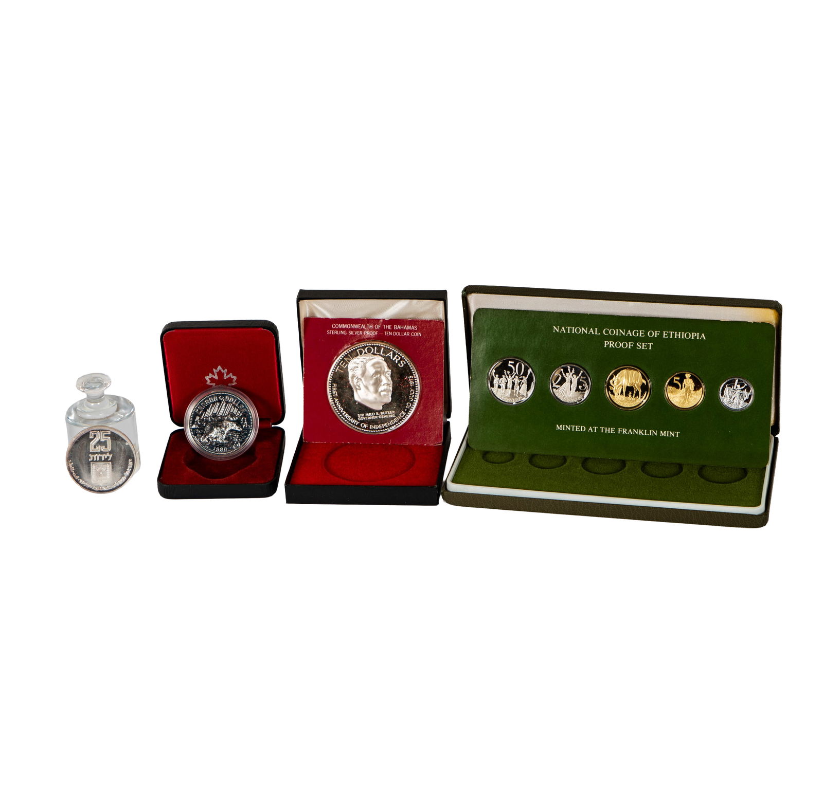 Collection of World Coins: 1-1977 Ethiopia Proof set with 5 coins in box with papers, 1-Israel Silver 25 Lirot in plastic holder, 1-1974 Bahamas $10 Silver Proof coin with box and papers, 1-1980 Canada $1 Silver Proof coin in b