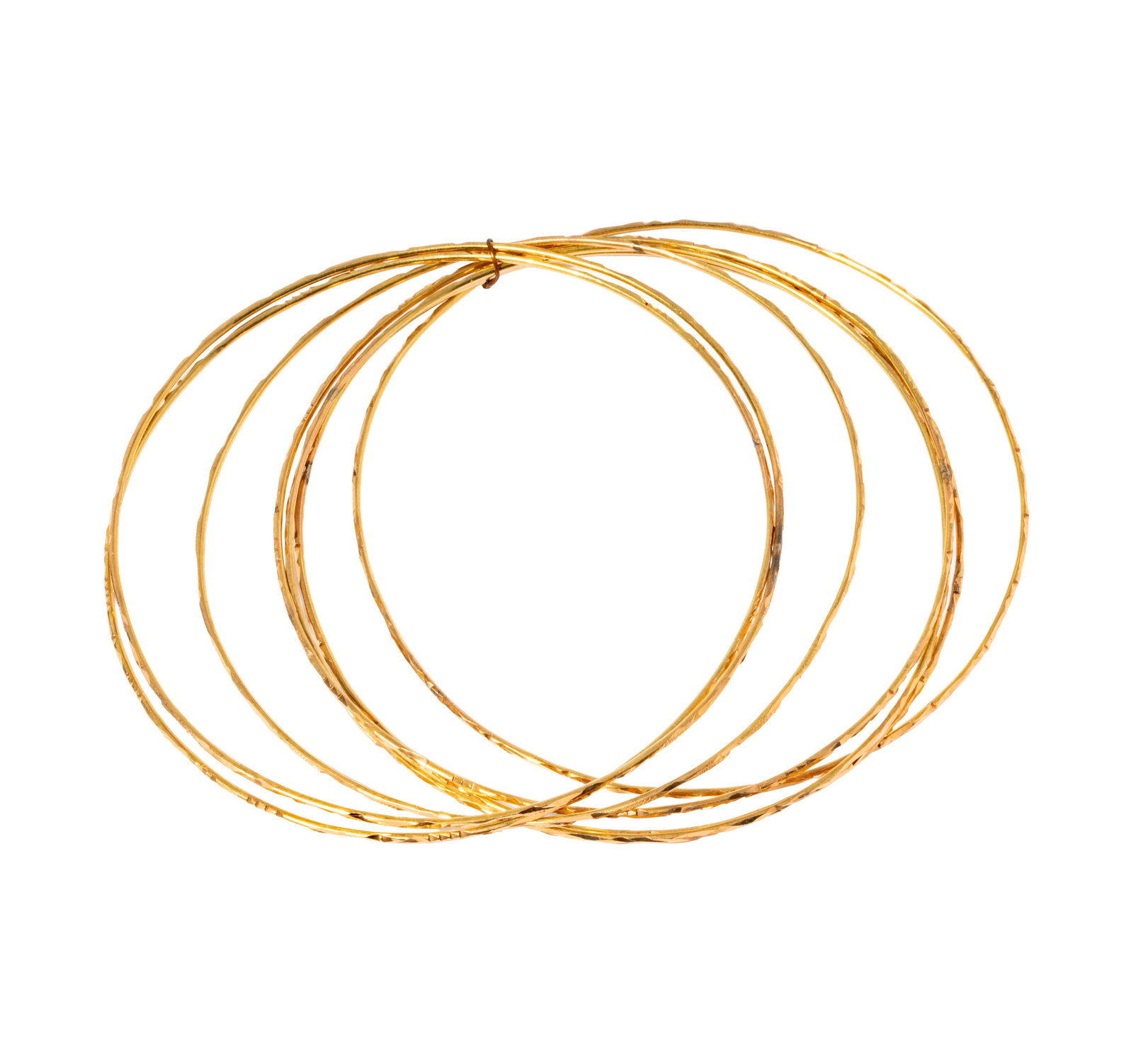 Seven 14 Karat Yellow Gold Bangles: Including a set of seven bangles measuring approximately 8 inches inside circumference, weighing 15.1 grams;